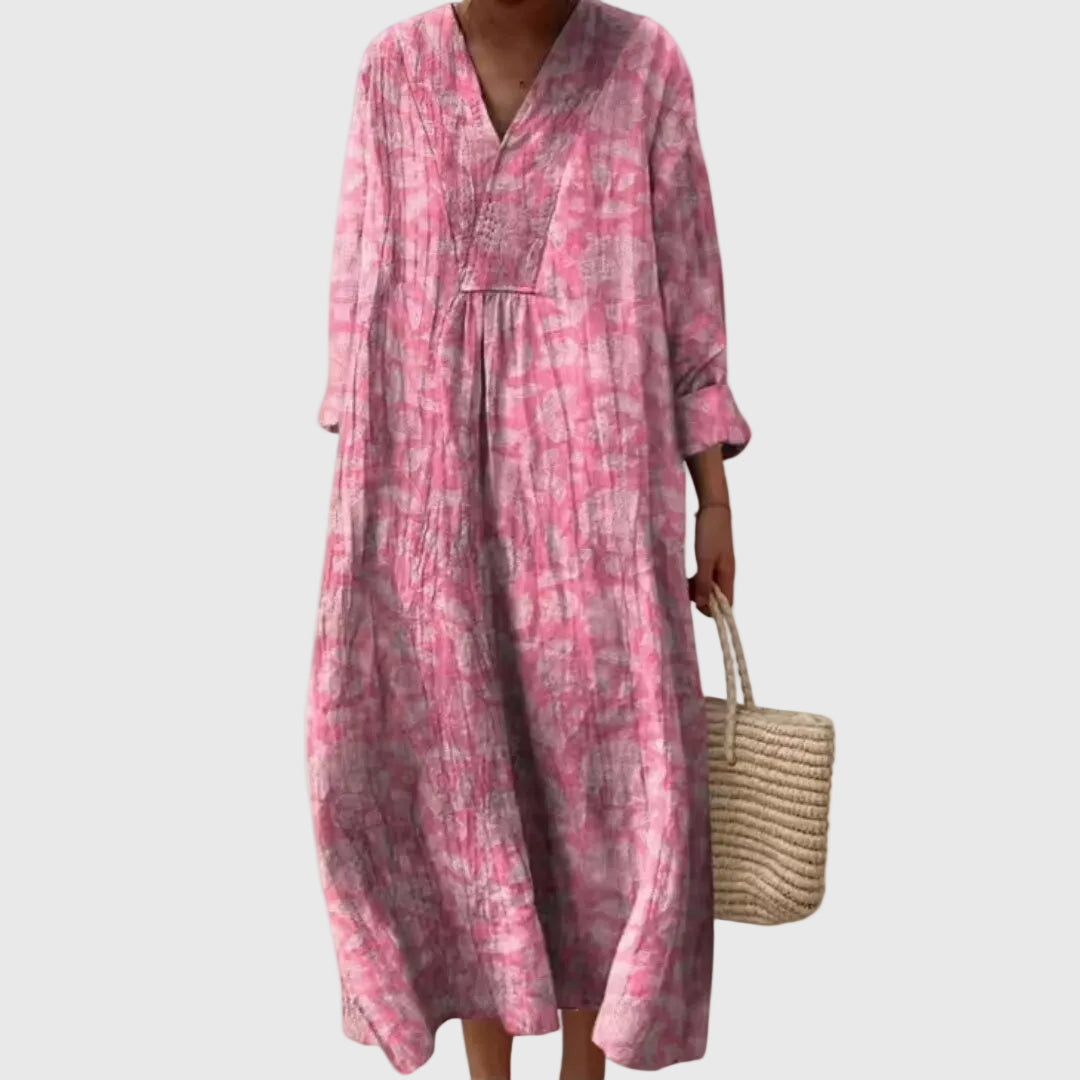 Montaracrest Stephanie midi geometric dress displayed on a hanger, showcasing its stylish pattern and elegant design.