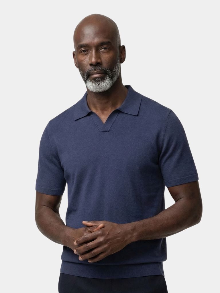 Montaracrest Polo Classe Marina in navy with white collar and logo, classic men's polo shirt displayed on a hanger.