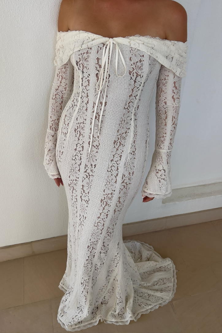 Elegant Montaracrest lace off-shoulder long-sleeve dress with intricate lace detailing and a fitted silhouette.