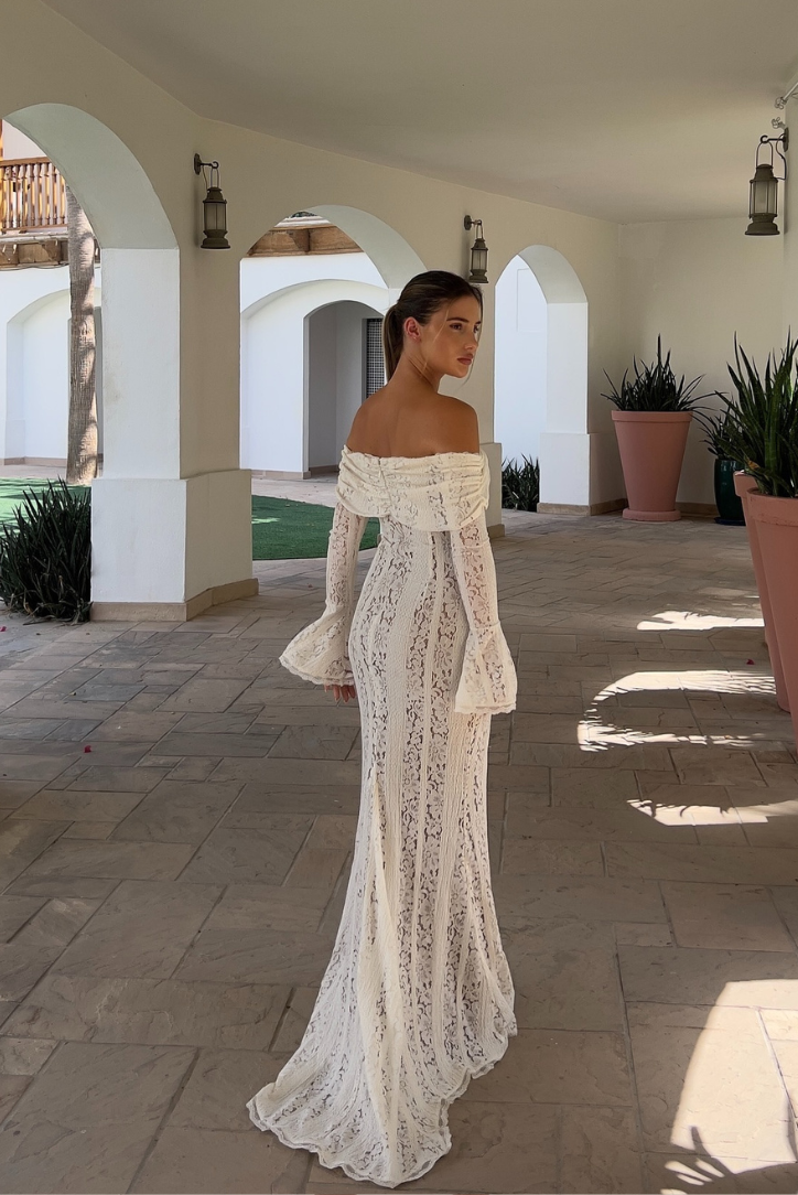 Elegant Montaracrest long-sleeve lace off-shoulder dress with intricate detailing and a fitted silhouette.