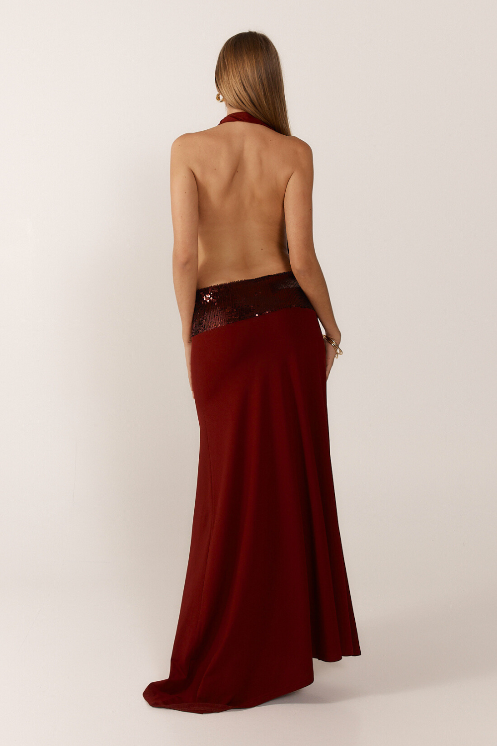 Montaracrest jade sequin gown featuring a flowing silhouette and intricate sequin detailing, perfect for elegant occasions.