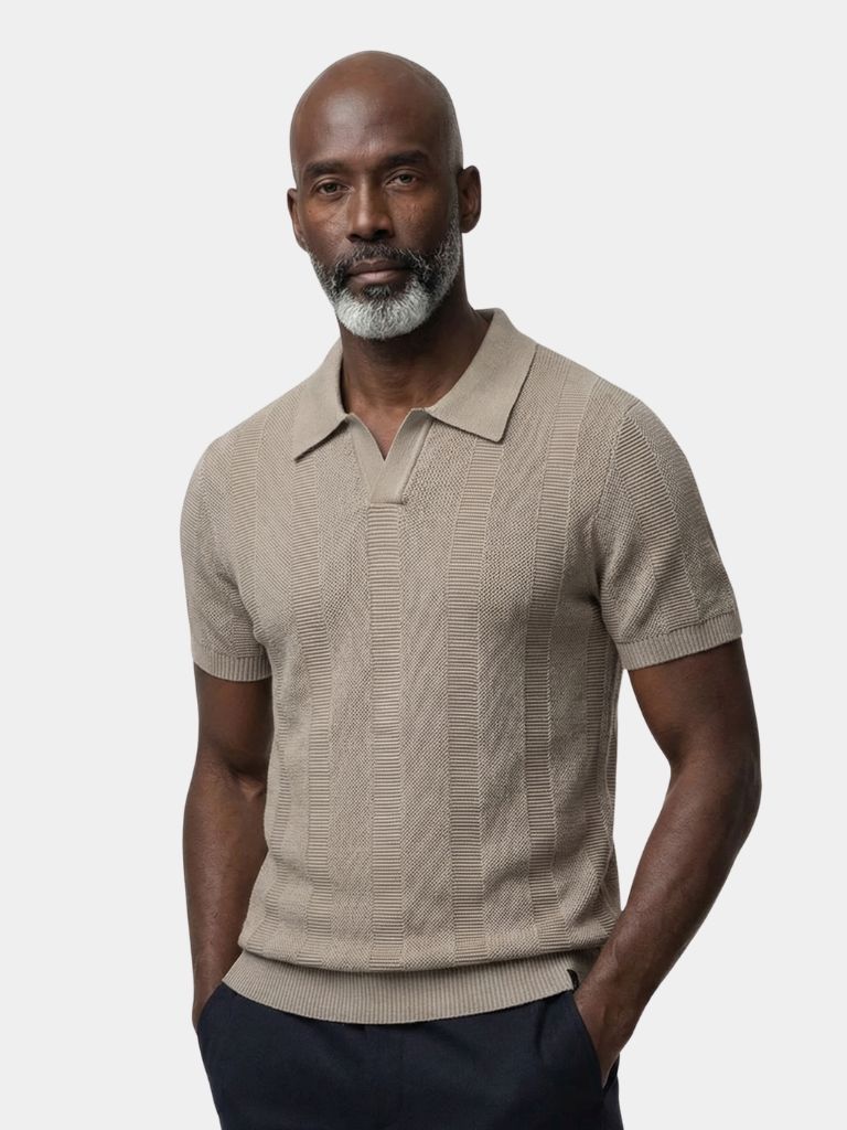 Beige Polo shirt by Montaracrest featuring classic collar and button placket, displayed on a neutral background.