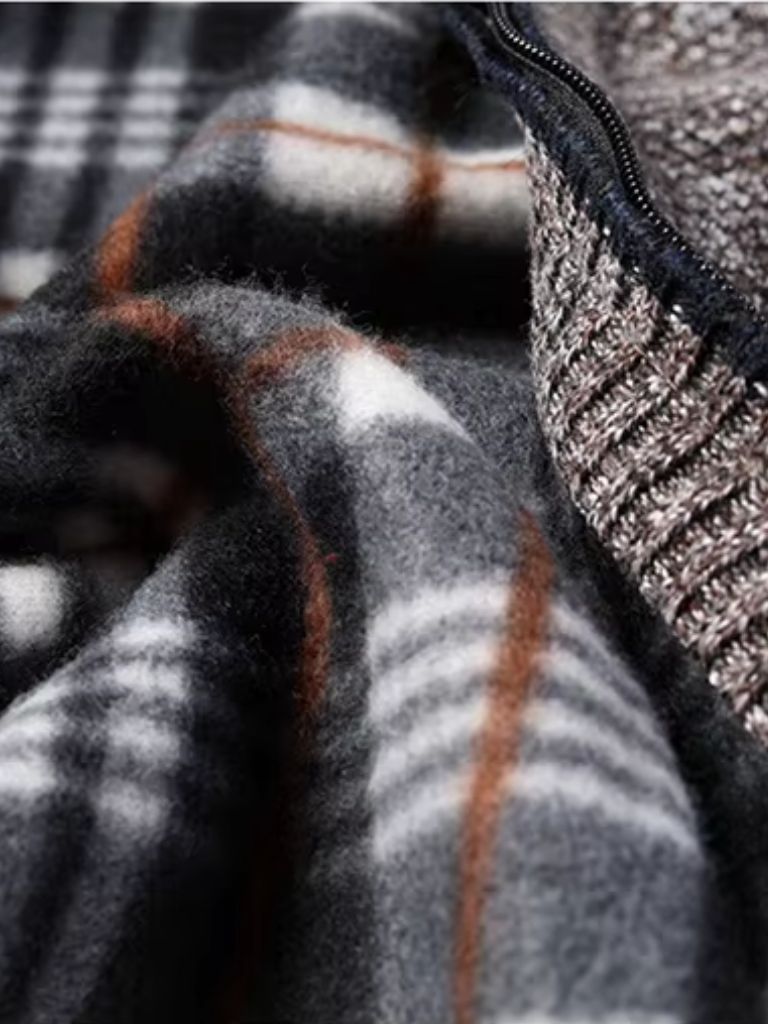 Montaracrest knitted jacket with textured pattern, long sleeves, and cozy fit, displayed on a hanger.