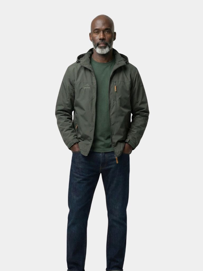 Montaracrest tactical waterproof jacket for expeditions, shown in dark color with hood and multiple pockets.