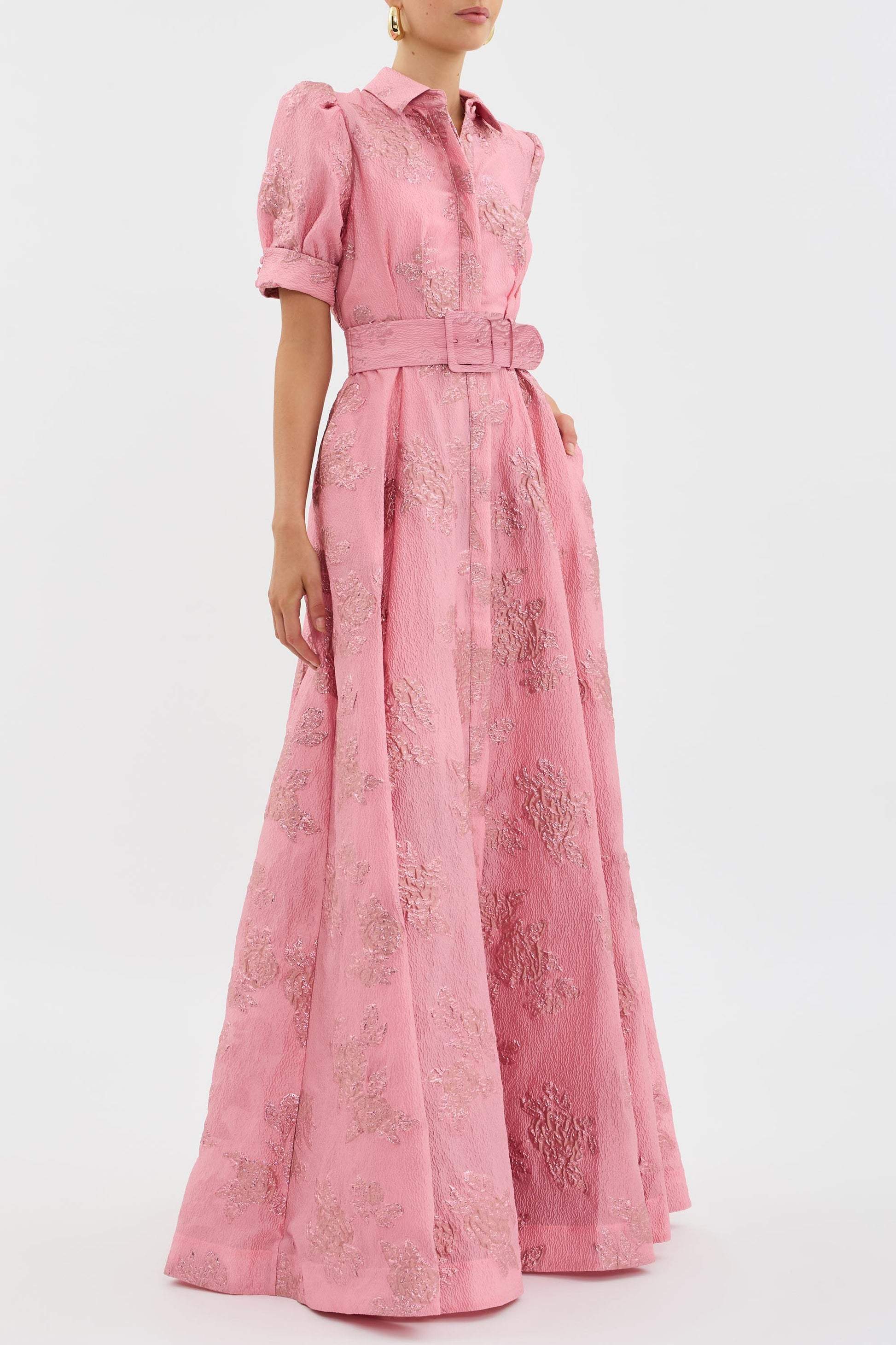 Long elegant dress with a waist belt by Montaracrest, featuring flowing fabric and a sophisticated design for timeless style.