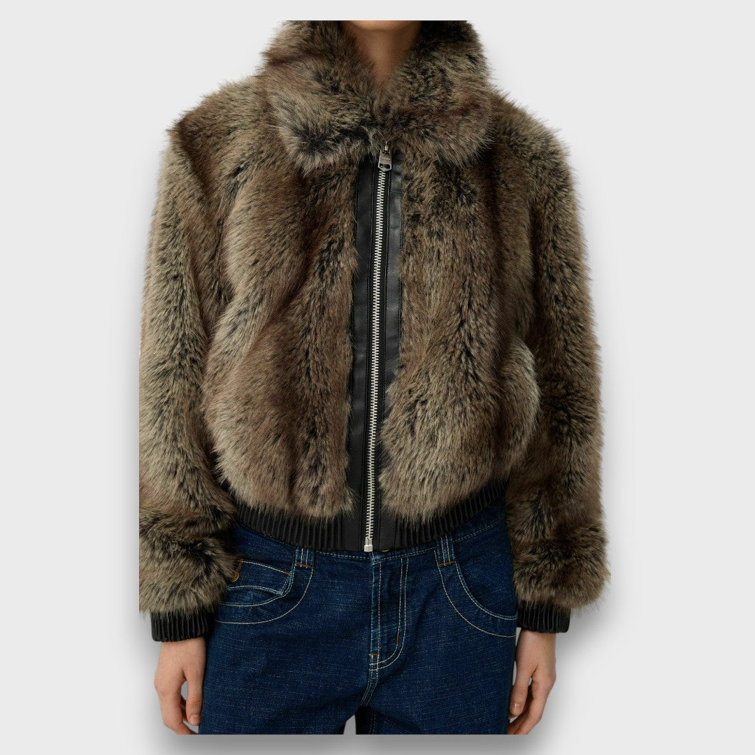 Montaracrest Amelia short synthetic fur jacket with urban chic style, displayed on a hanger.
