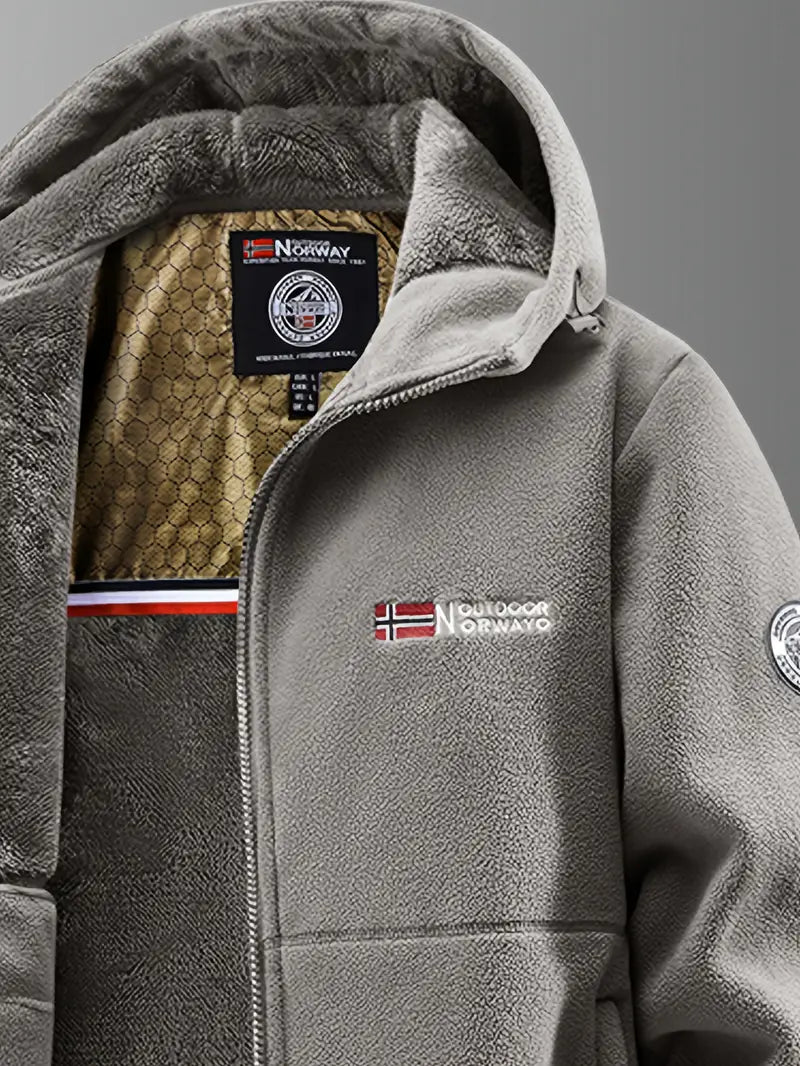 Montaracrest Nathaniel winter jacket in thermofleece, showing a close-up of the insulated, dark-colored winter coat with a high collar.