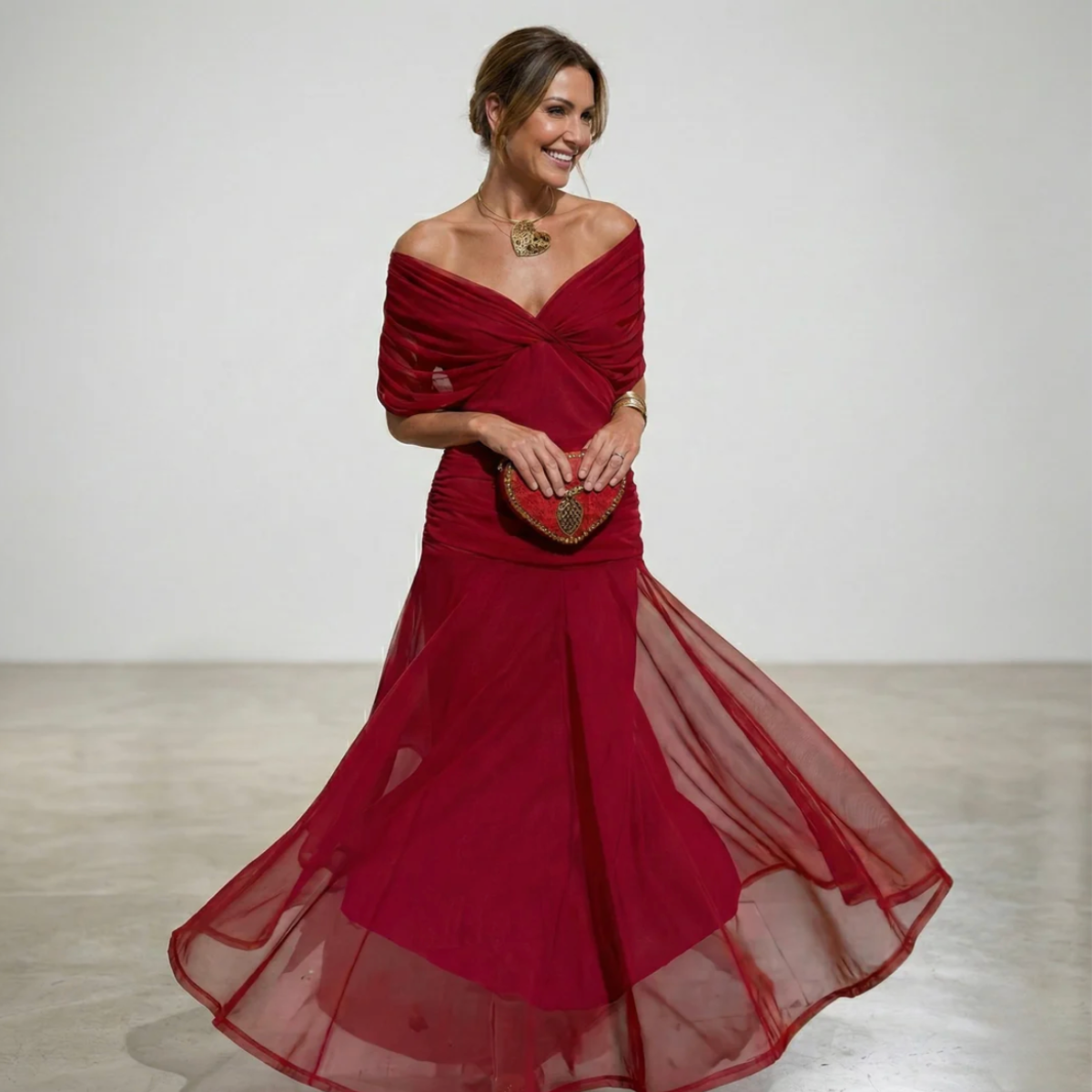 Elegant Montaracrest Luisa long dress with V-neckline, enhances silhouette, featuring flowing fabric and stylish design.