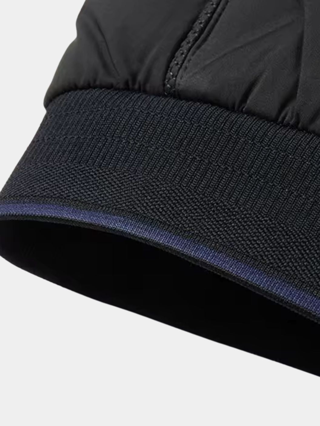 Montaracrest Savoy Heritage bomber jacket in black with zip closure and ribbed cuffs, displayed on a hanger.