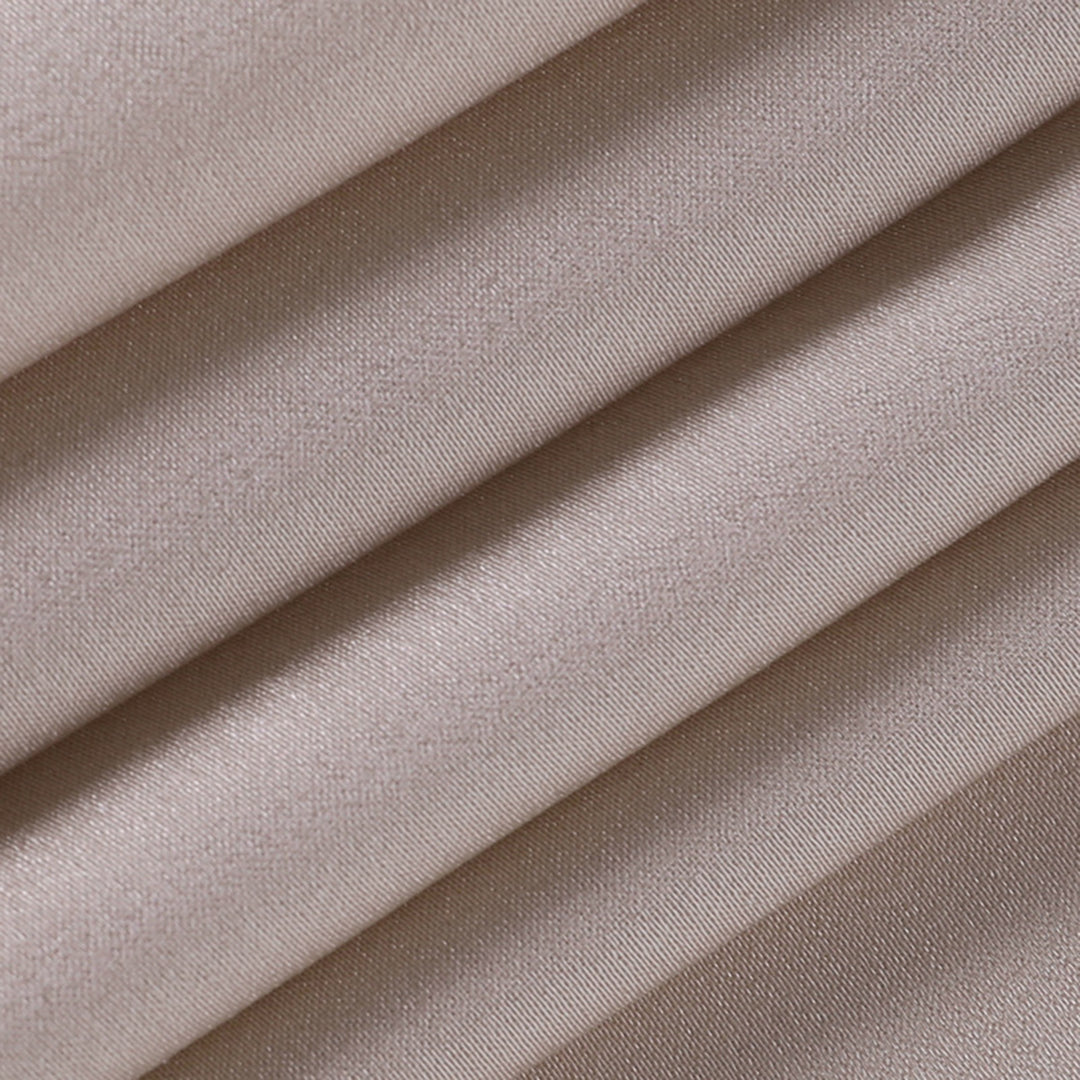 Elegant long slip dress with side slit from Montaracrest, flowing fabric and subtle design details visible in the image.