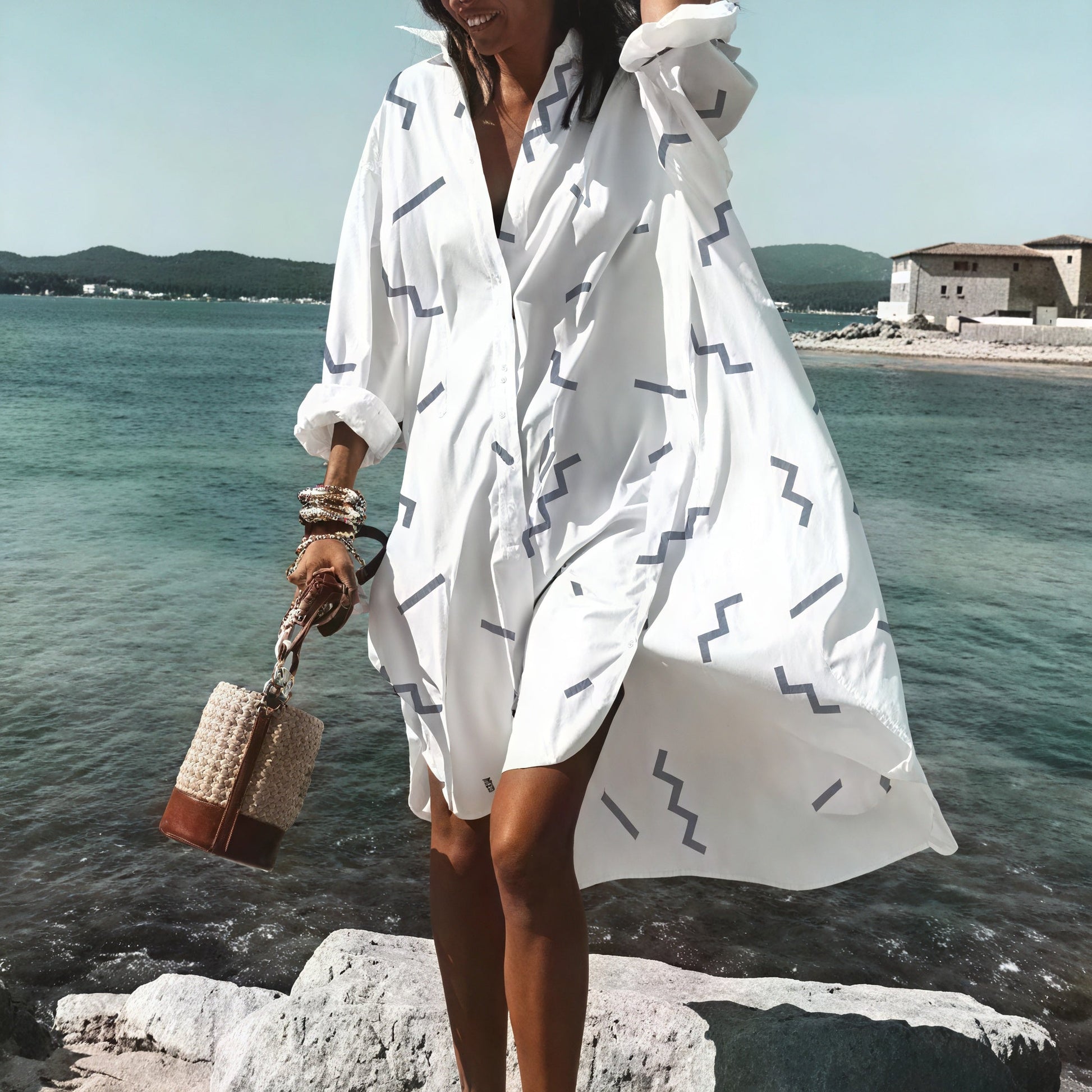 Light beige oversized summer dress with button details from Montaracrest, featuring a relaxed fit and casual style.
