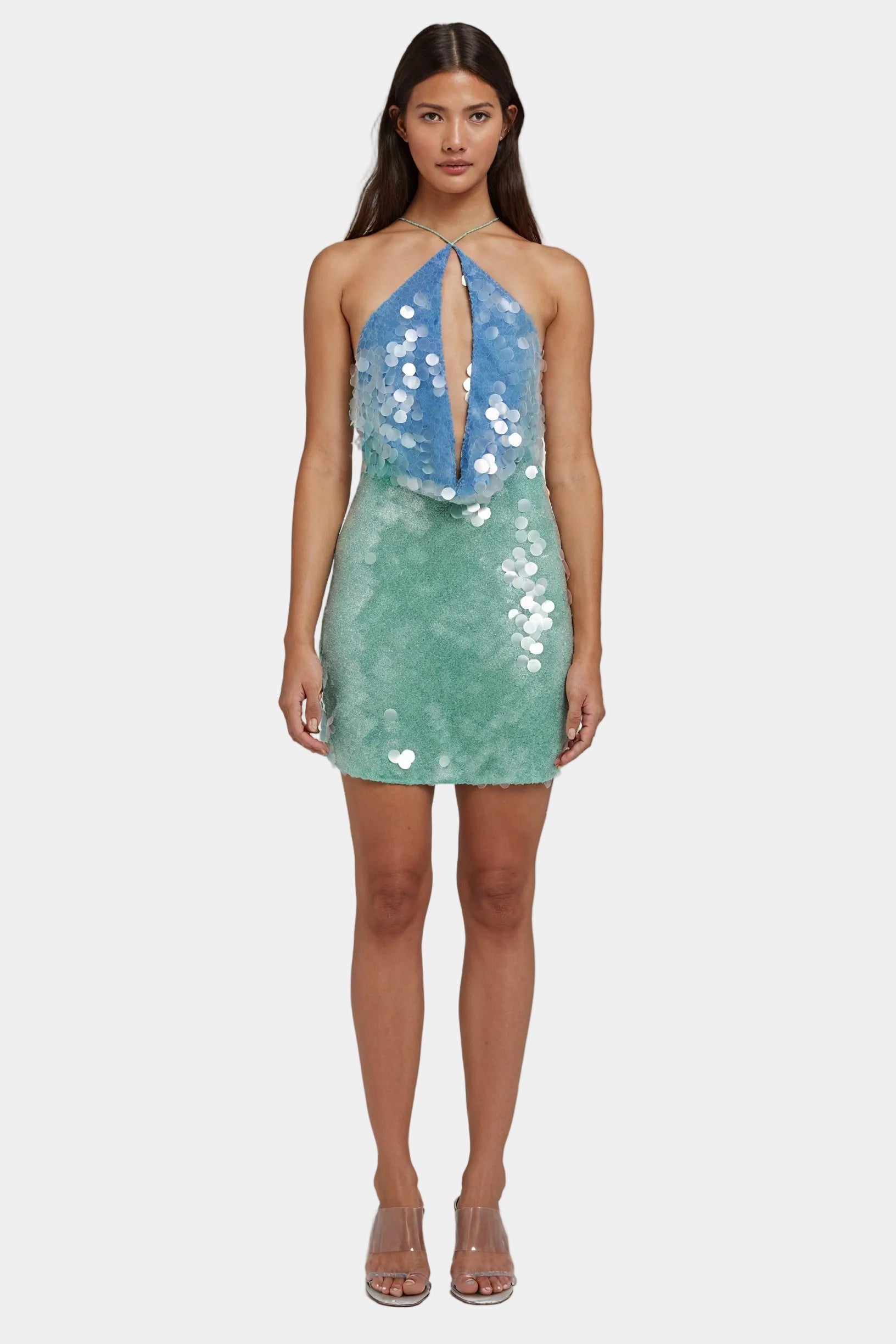 Shimmering mini halter dress with sequins by Montaracrest, featuring a fitted silhouette and stylish halter neckline.