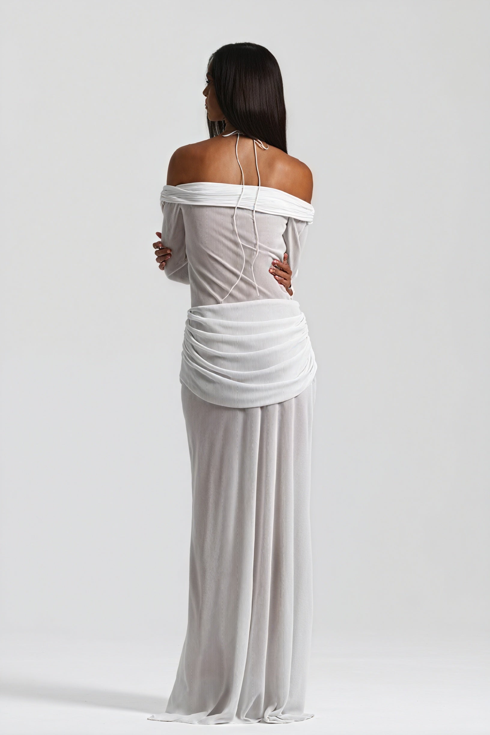 Montaracrest long dress with knot and cutout design, featuring a flowing silhouette and modern style.