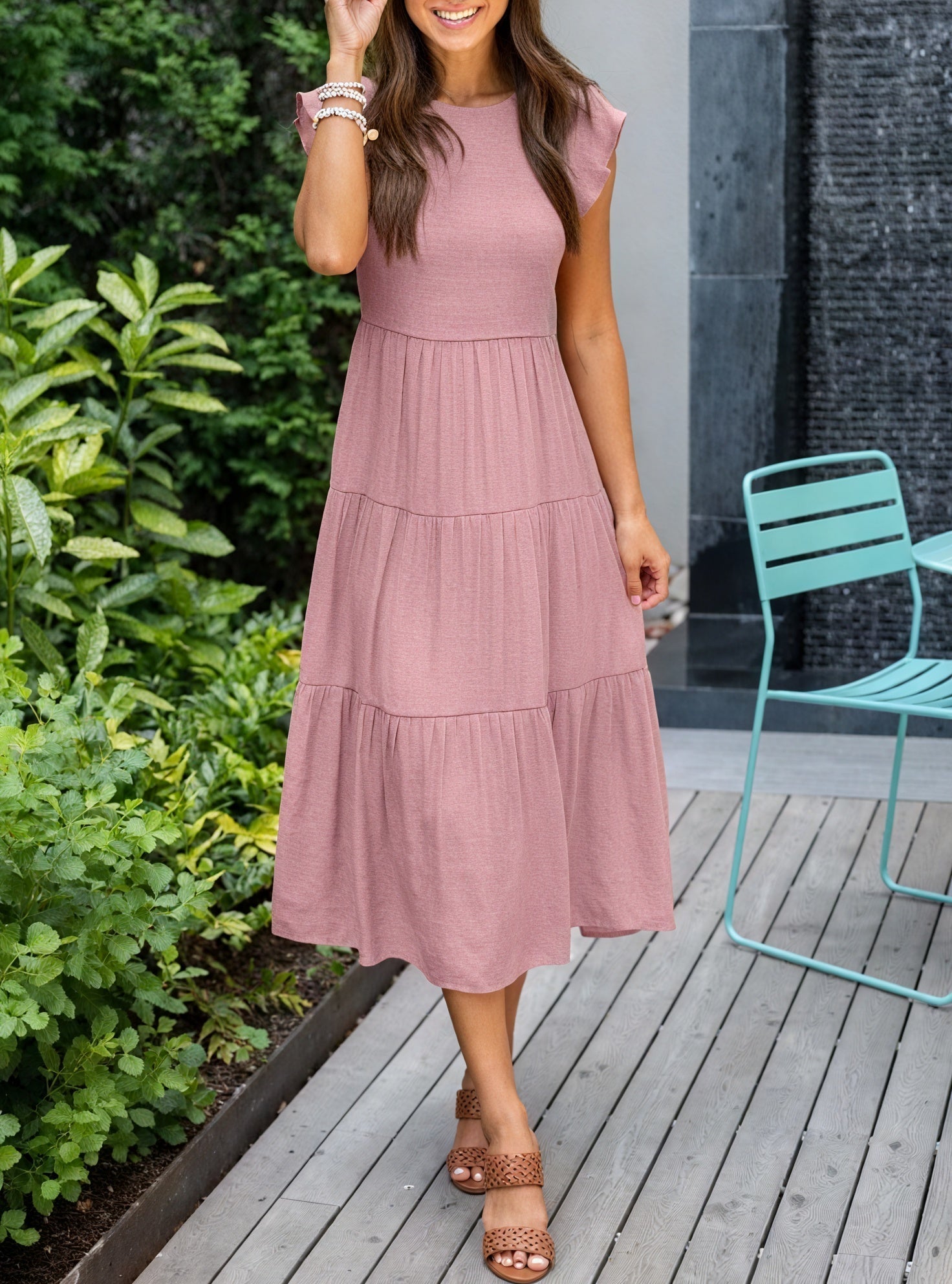 Flowy chiffon dress with ruffled sleeves and tiered skirt, designed by Montaracrest, featuring elegant, feminine details.