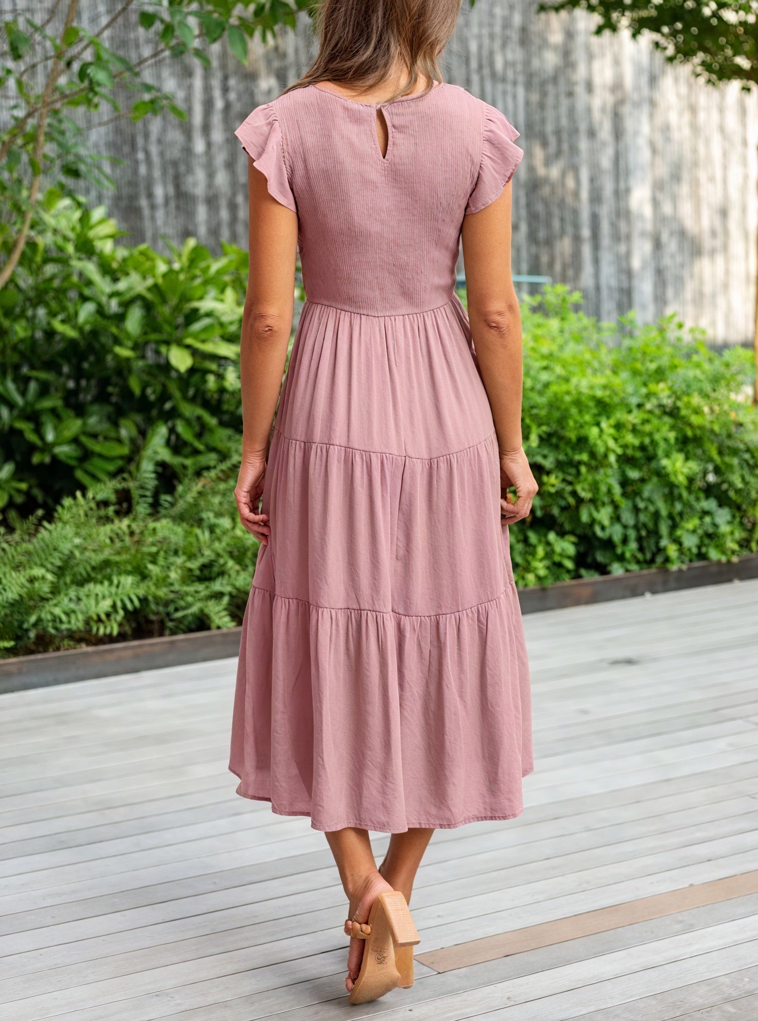 Flowy chiffon dress with ruffle sleeves and tiered design by Montaracrest, featuring delicate fabric and feminine style.