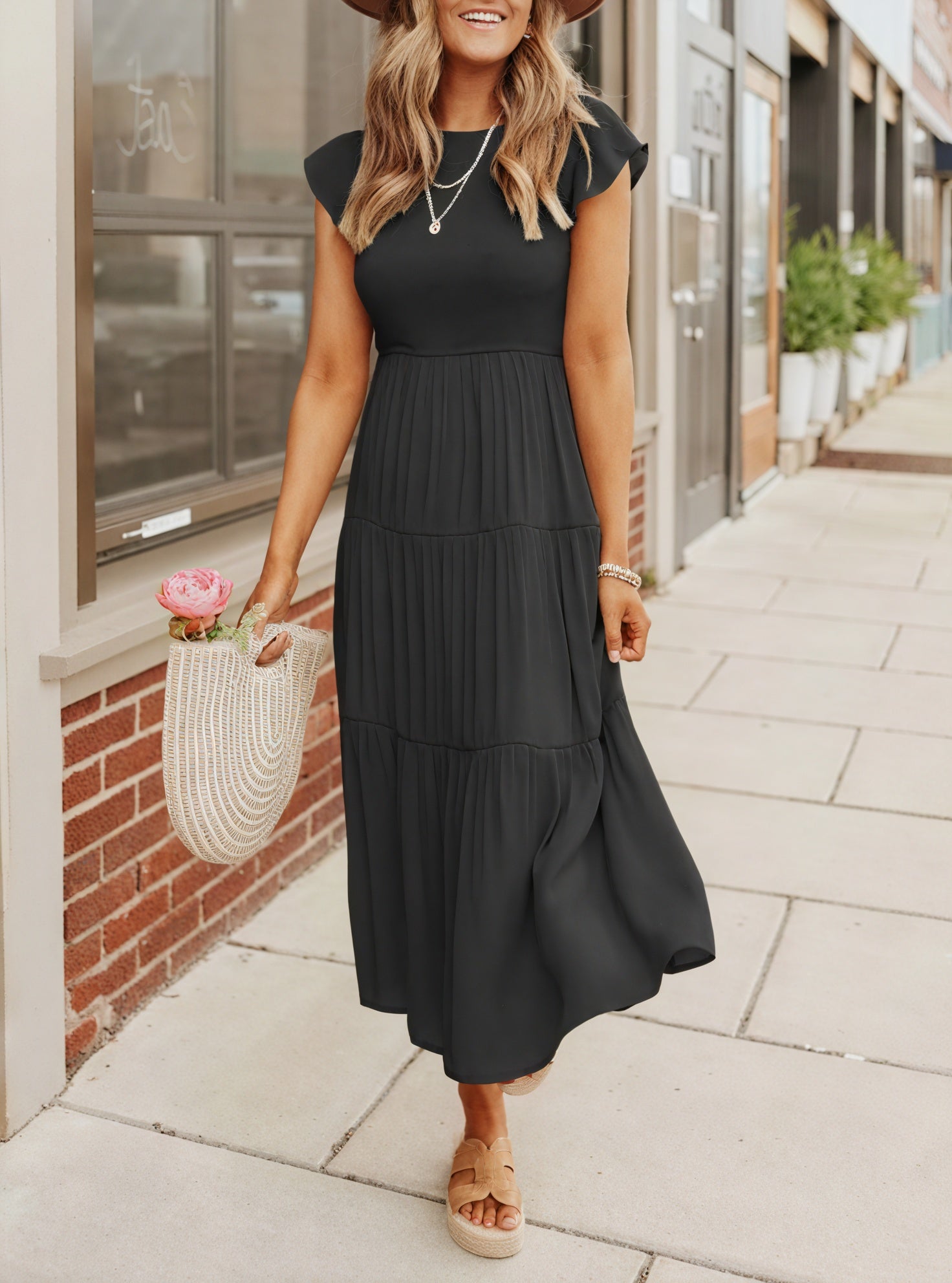 Flowy chiffon dress with ruffle sleeves by Montaracrest, featuring a tiered design and voluminous details.