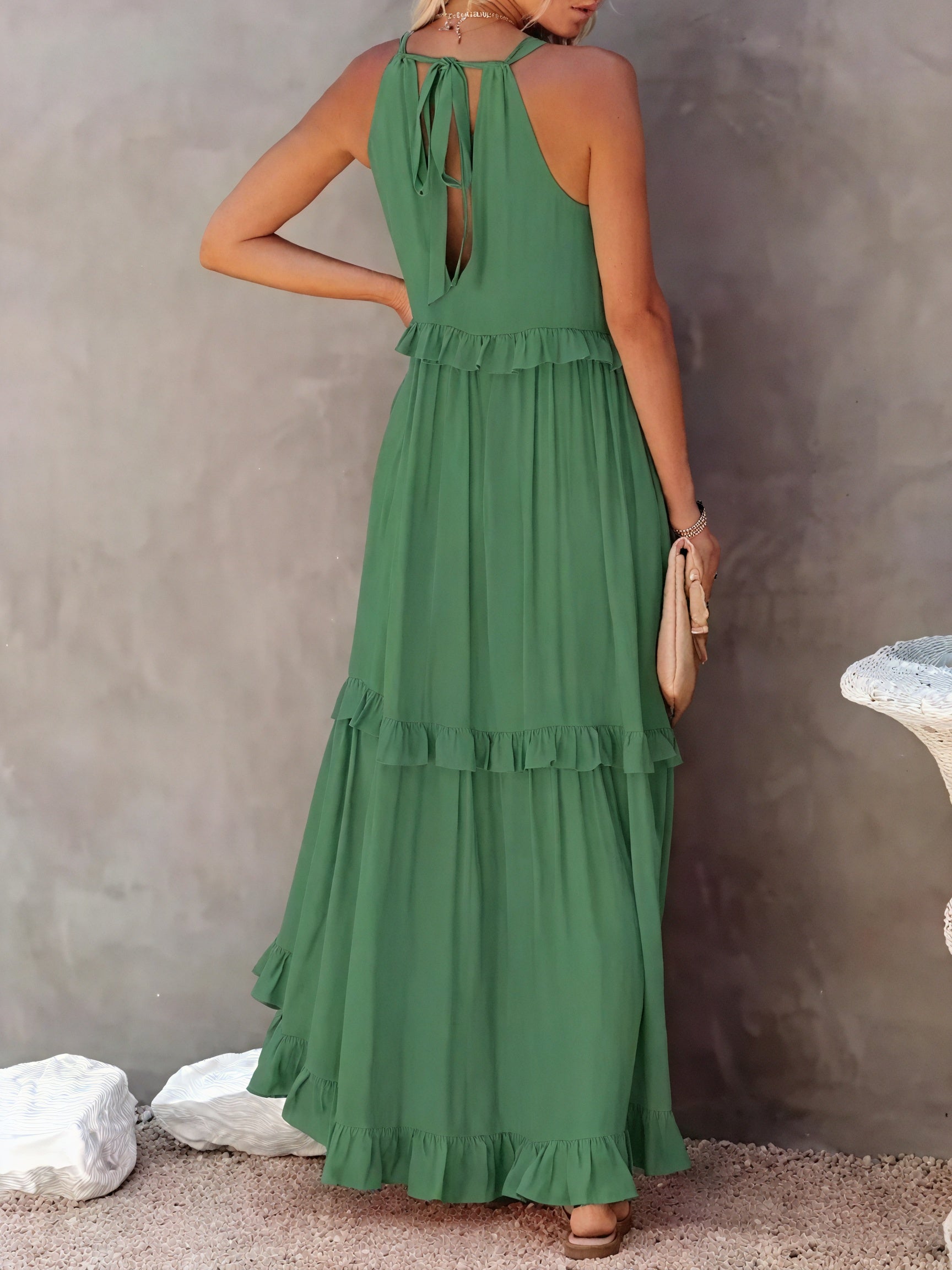 Flowy maxi dress with American-style neckline and ruffle details by Montaracrest, shown on a model.