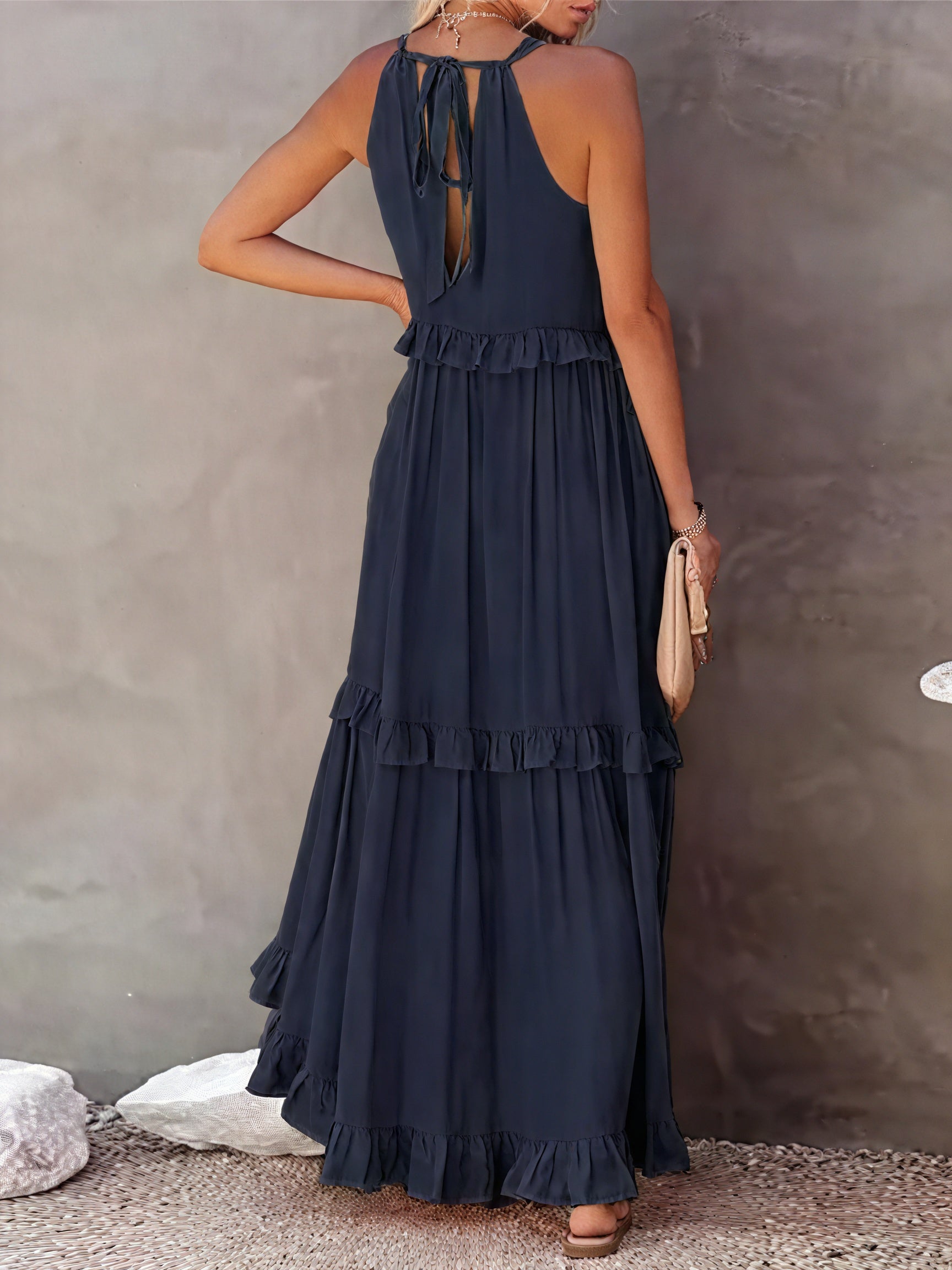 Maxi fluid dress with American-style neckline and ruffle details by Montaracrest, shown on a model.