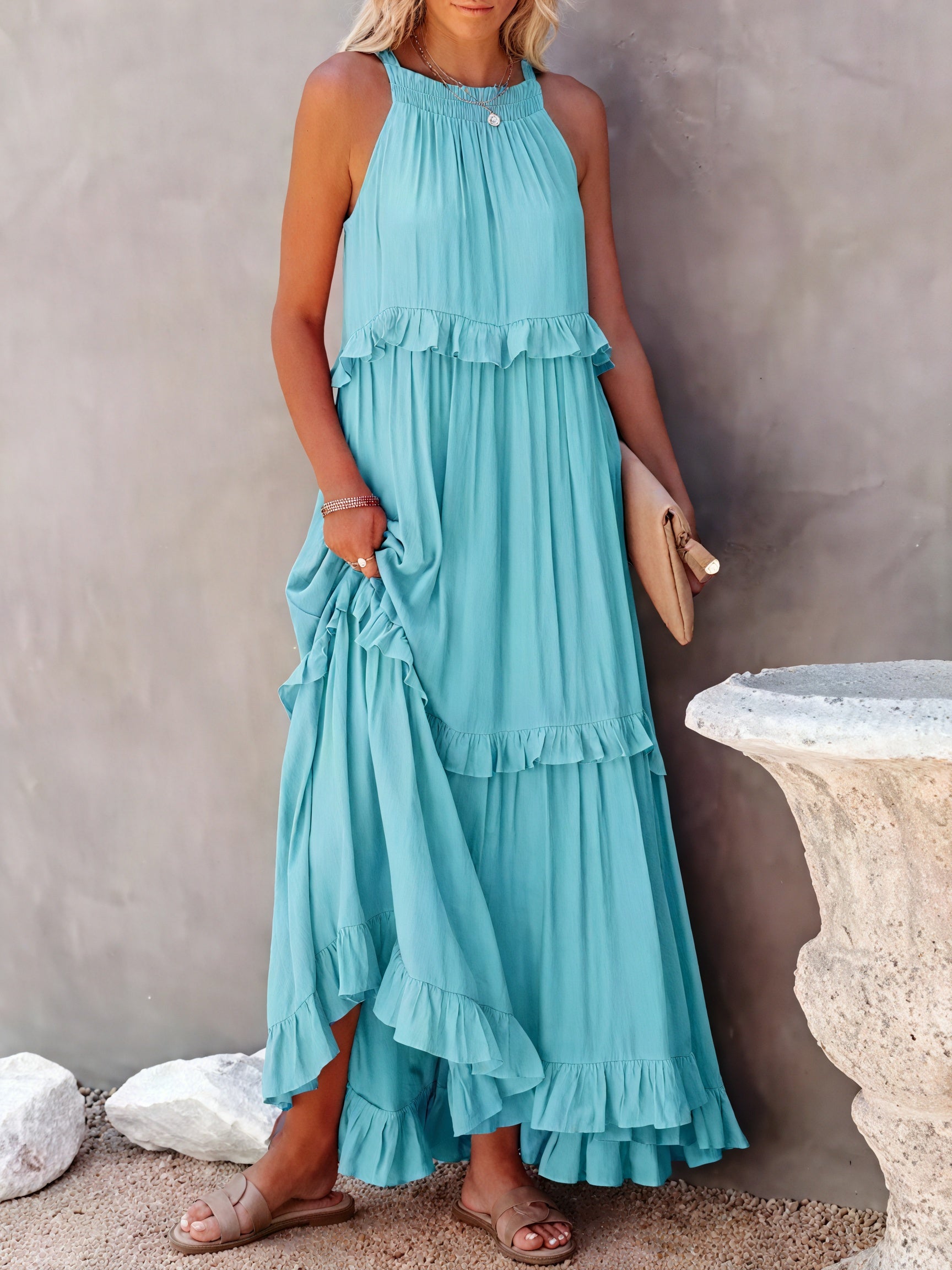 Flowy maxi dress with American-style neckline and ruffle details by Montaracrest, shown on a model.