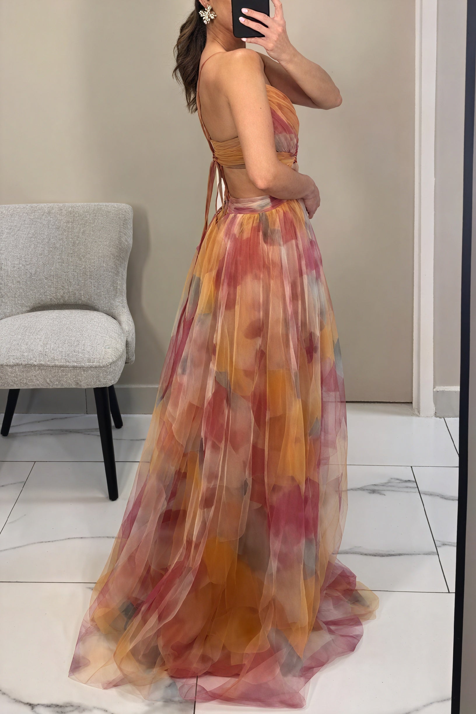 Elegant Celeste™ ethereal dress by Montaracrest featuring flowing fabric and luminous charm, shown in a stylish fashion pose.