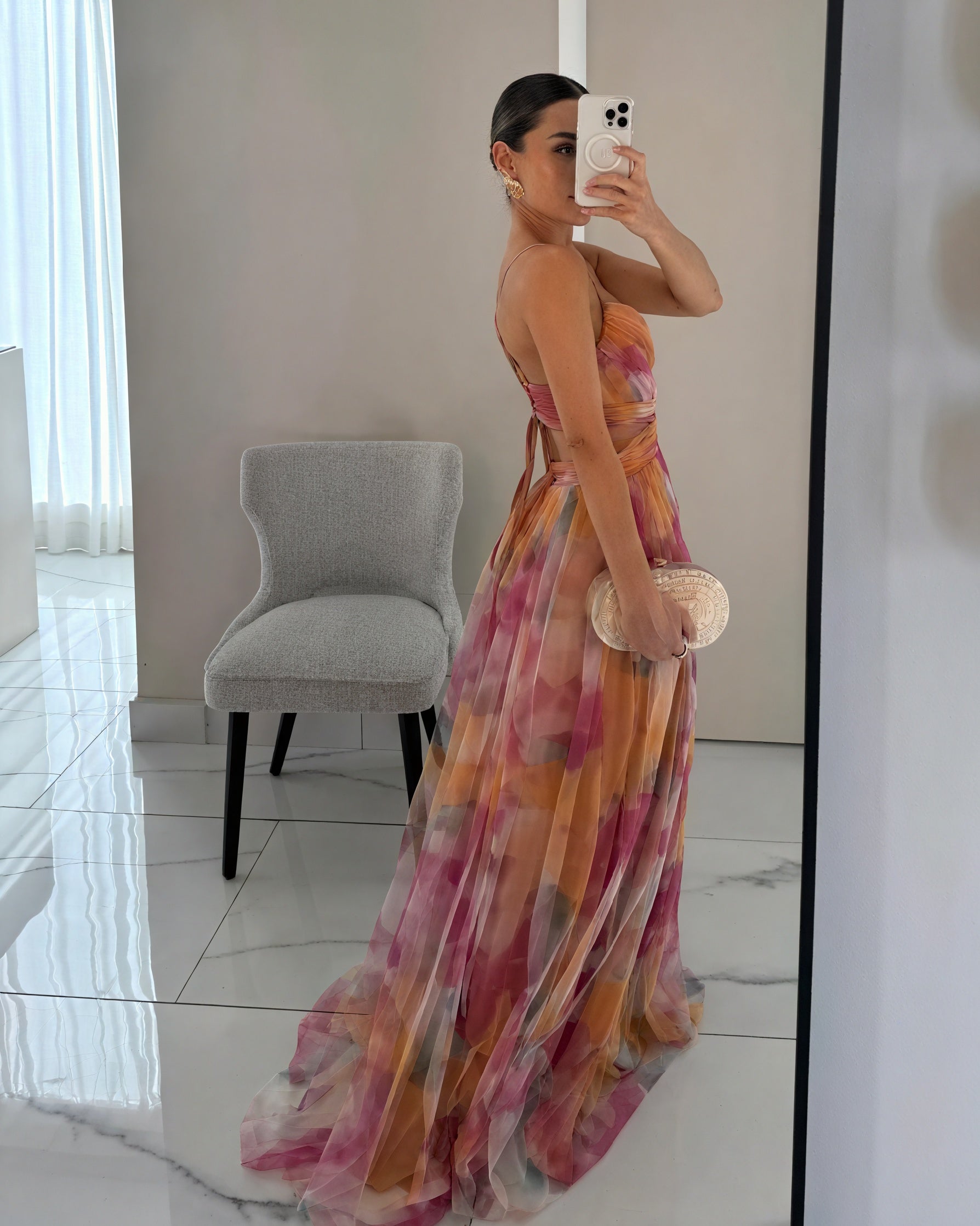 Elegant Celeste™ ethereal dress by Montaracrest featuring flowing fabric and luminous charm, shown in a graceful design.