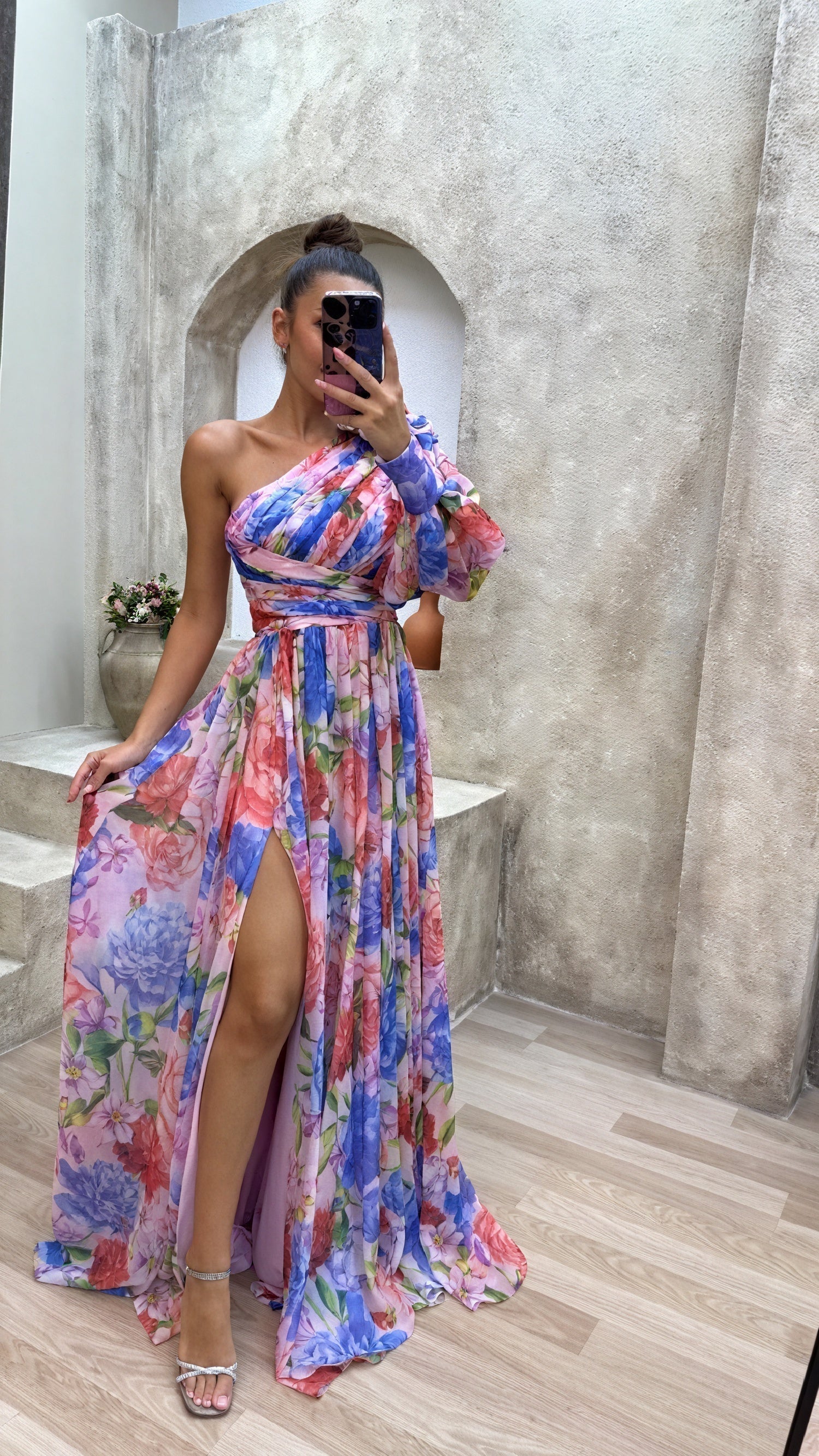 Elegant montospalla dress by Montaracrest with floral print and side slit, perfect for stylish summer occasions.