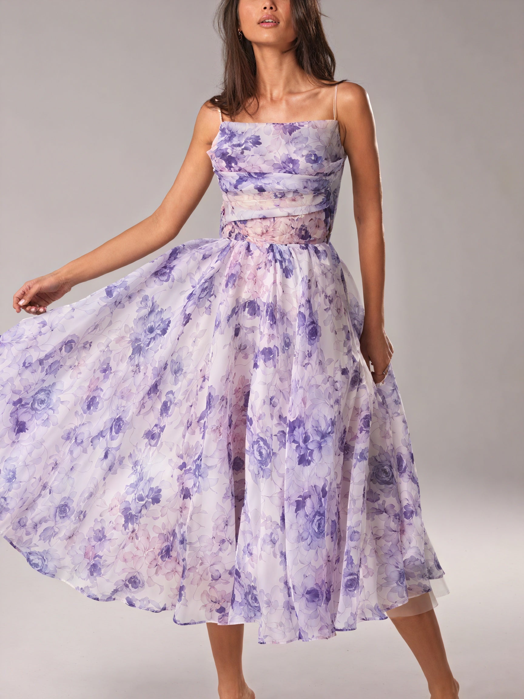 Floral midi dress by Montaracrest featuring a spring-inspired design, lightweight fabric, and elegant silhouette.