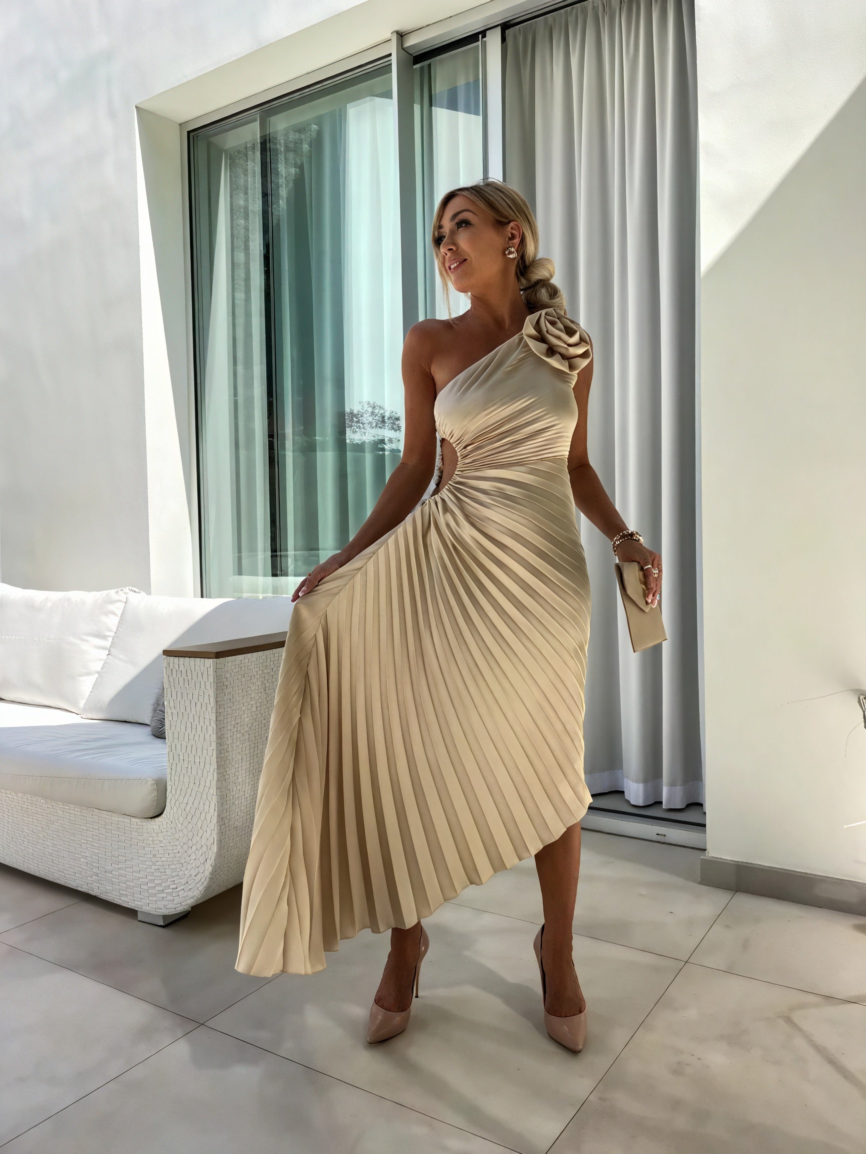 Elegant one-shoulder dress by Montaracrest featuring flowing fabric and sophisticated design for stylish occasions.