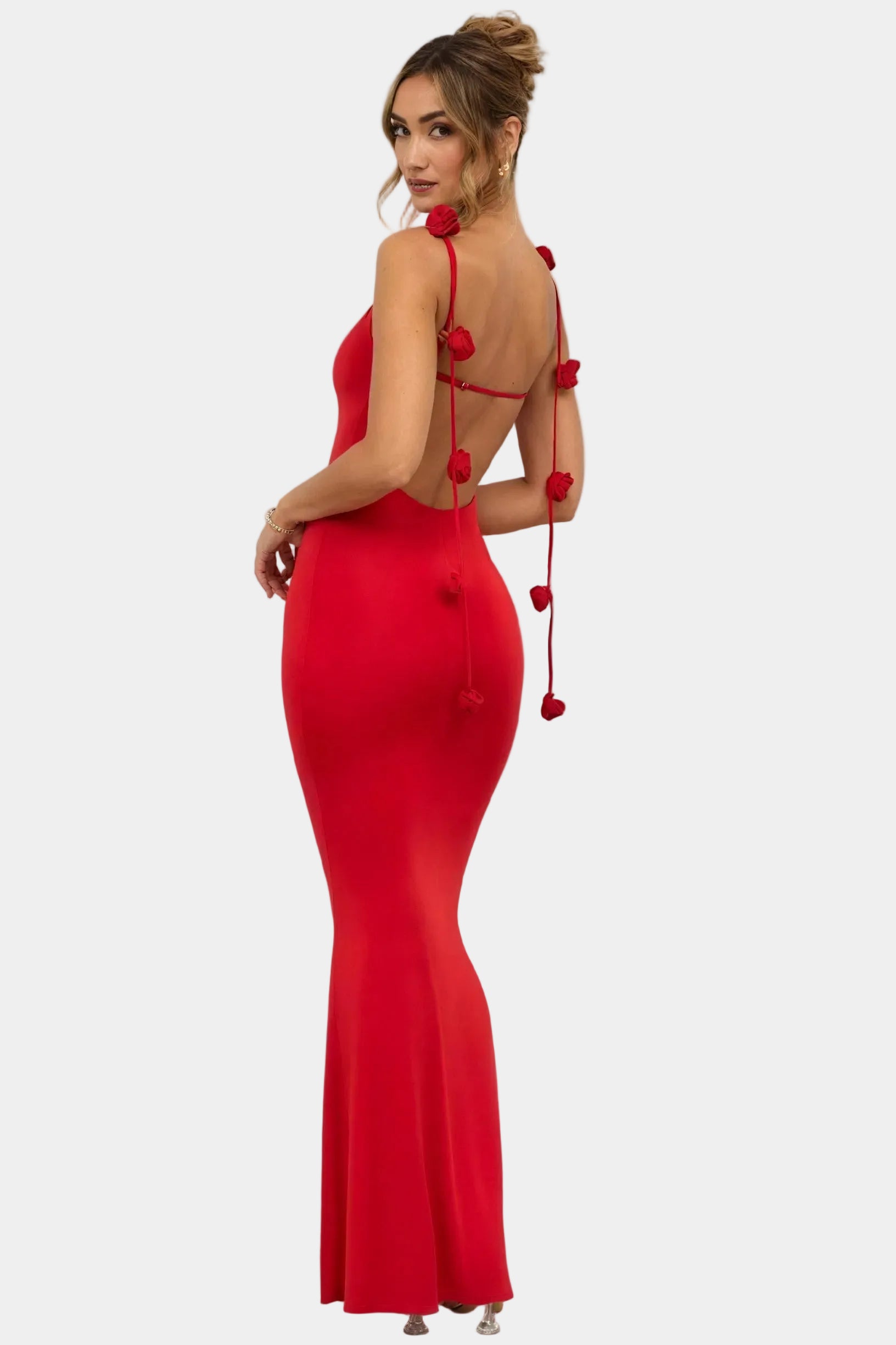 Elegant long women's dress by Montaracrest featuring floral details and an open back.