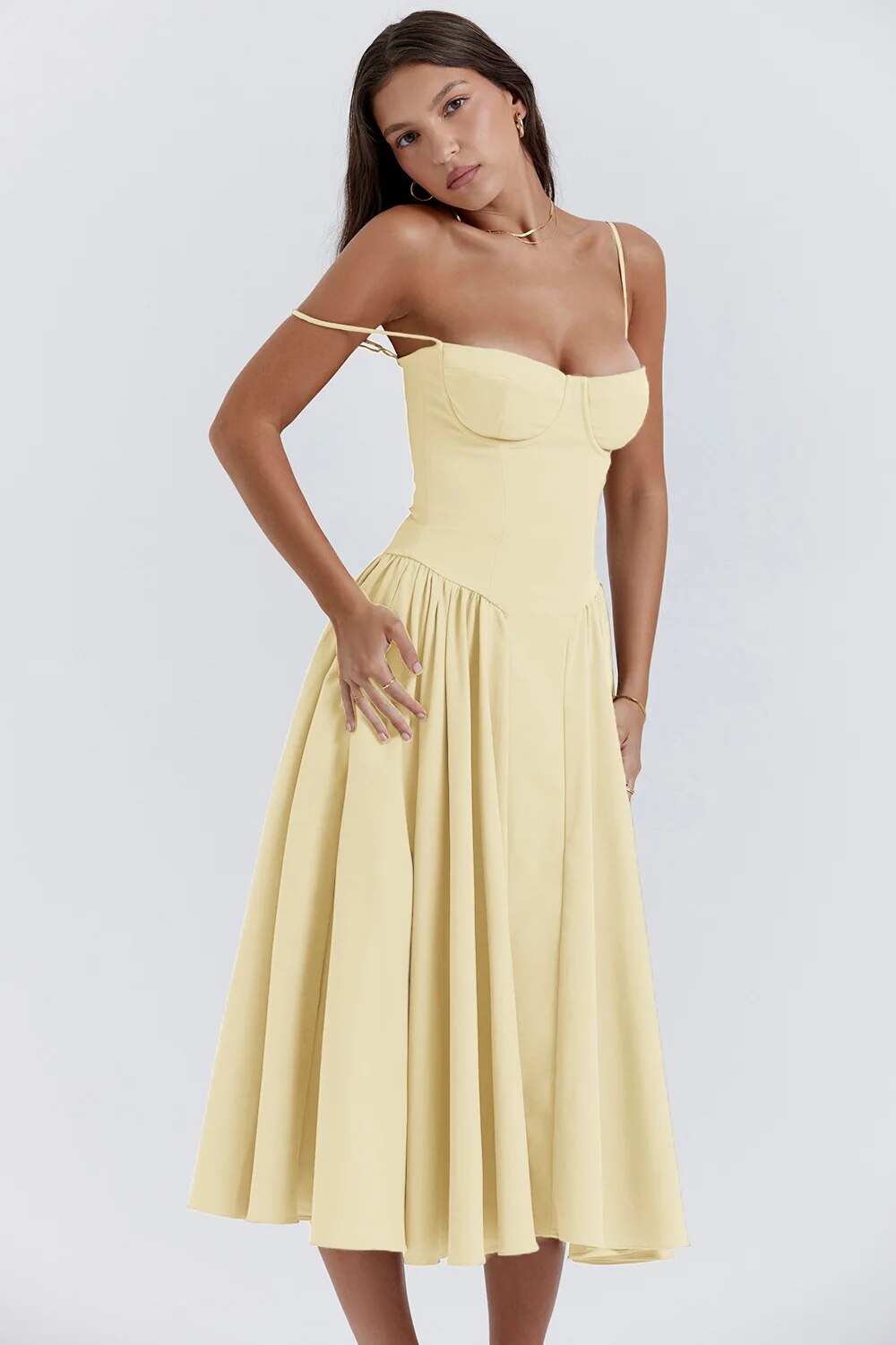 Montaracrest midi pleated dress with structured bodice and side pockets, showcasing elegant fashion for versatile occasions.