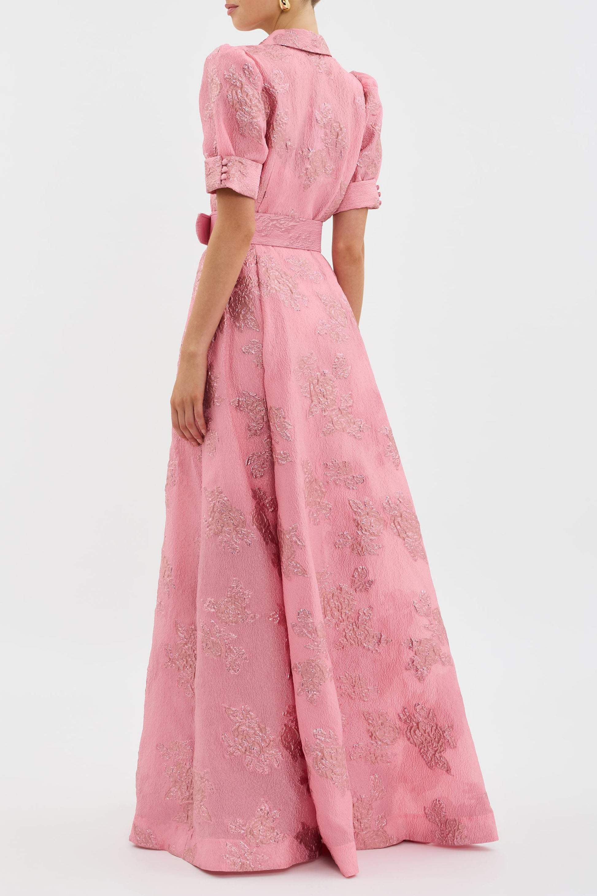 Elegant long dress with a waist belt by Montaracrest, featuring flowing fabric and classic design for timeless style.
