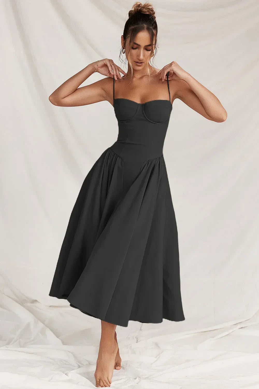 Montaracrest midi pleated dress with structured bodice and pockets, showcasing a stylish and elegant design.
