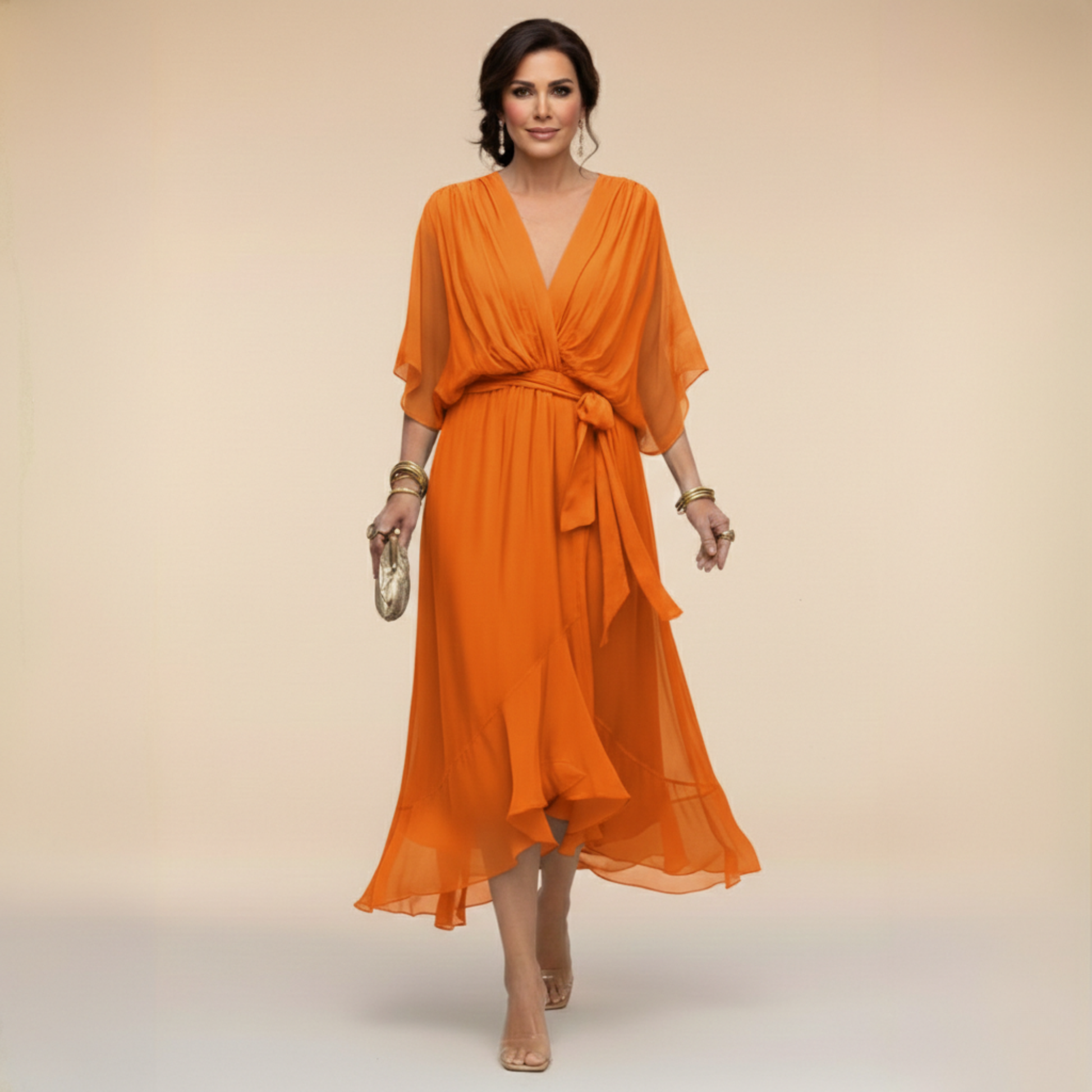 Montaracrest Monica chiffon dress with V-neckline, flowing fabric, and elegant sleeveless design displayed on a hanger.