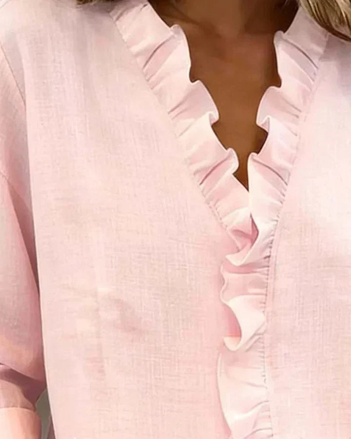 Montaracrest Chiara™ V-neck blouse with delicate ruffled details and feminine design, stylish and elegant for everyday wear.