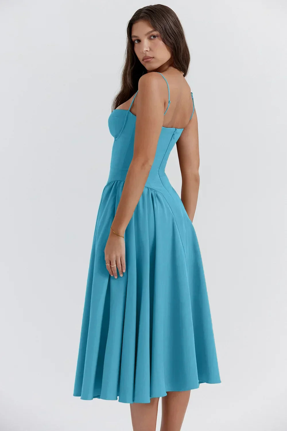 Montaracrest midi pleated dress with structured bust, featuring side pockets and elegant design, shown on a model.