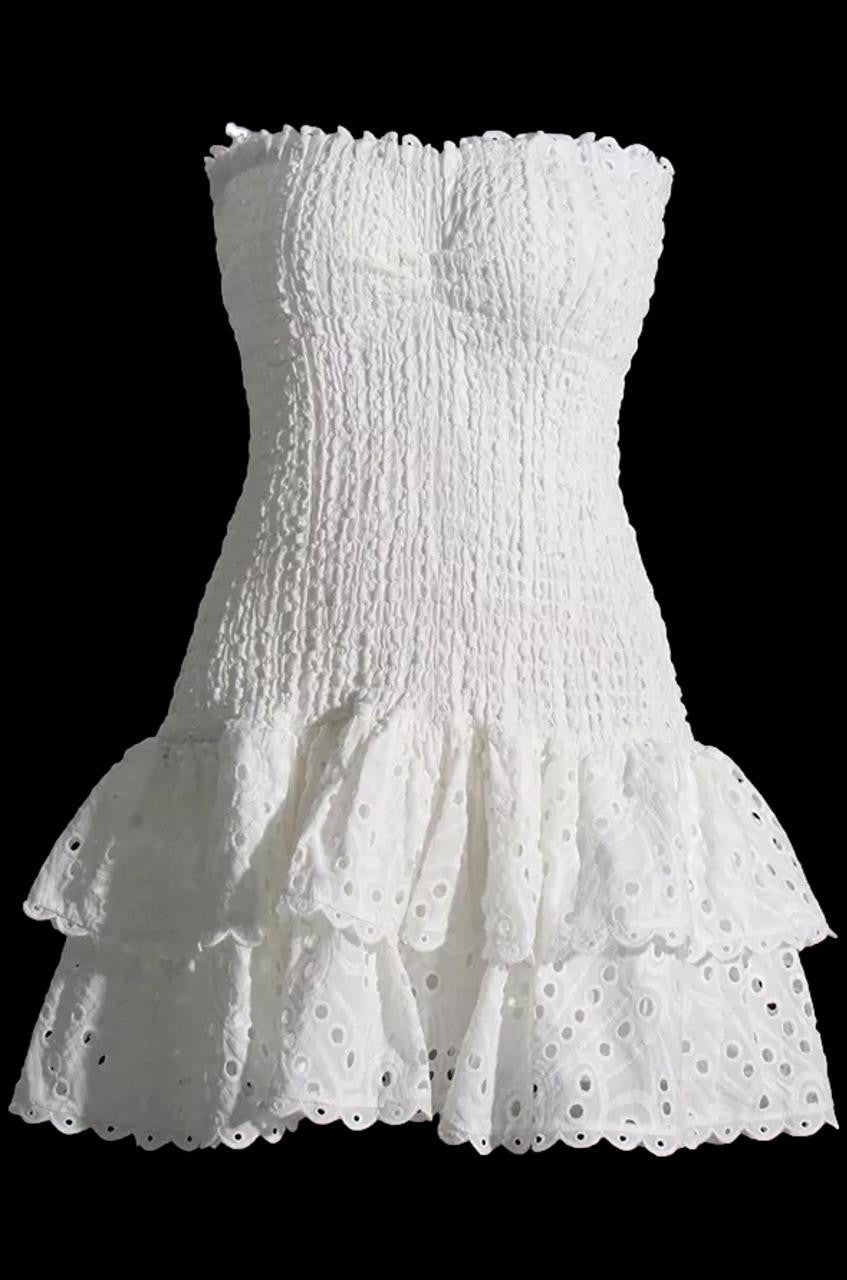 White Layorza Broderie Anglaise Strapless Mini Dress by Montaracrest, featuring intricate embroidery and a stylish, fitted design.