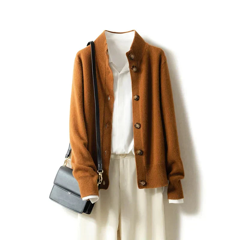 Montaracrest Arlina Merino Cardigan in soft wool, displayed on a hanger showing its classic knit design and cozy fit.