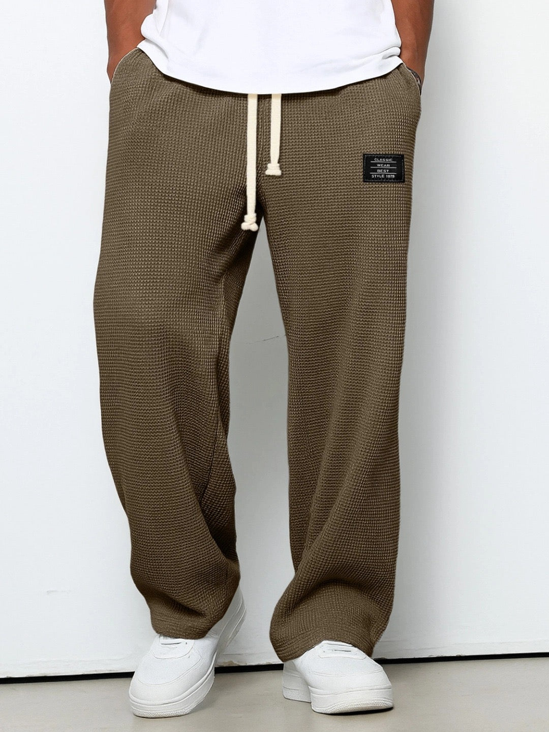 Montaracrest Lorenzo wide-leg pants with honeycomb textured fabric, featuring a relaxed fit and stylish design.