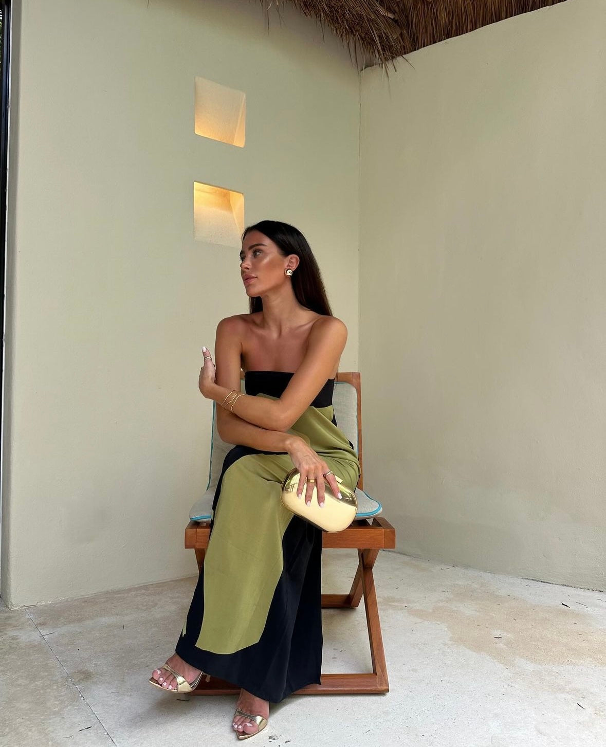 Montaracrest abstract strapless maxi dress shown on a hanger, featuring vibrant patterns and flowing fabric for elegant summer wear.