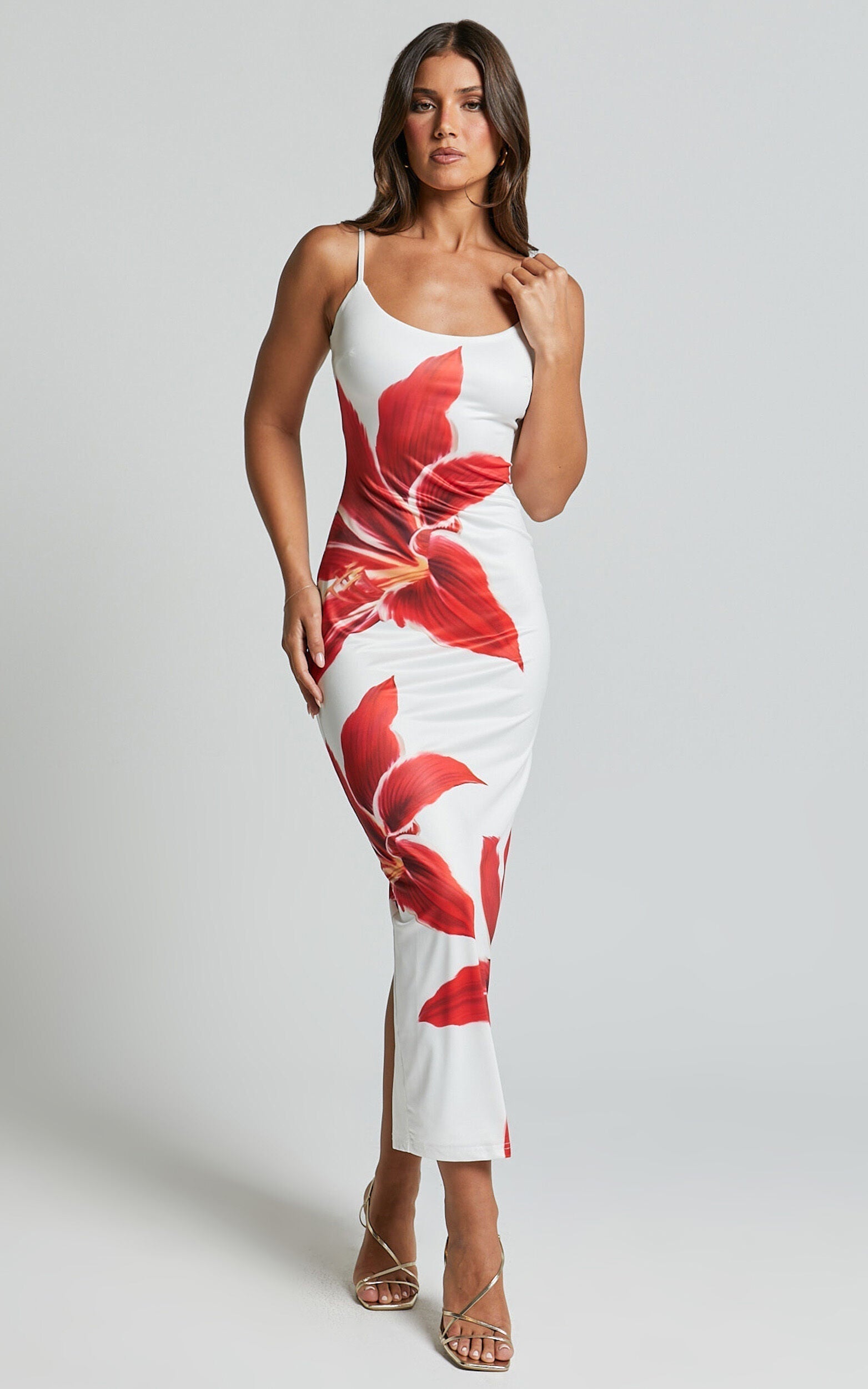 Montaracrest Lily Bloom dress displayed on a hanger, featuring floral patterns and lightweight fabric for casual or summer wear.