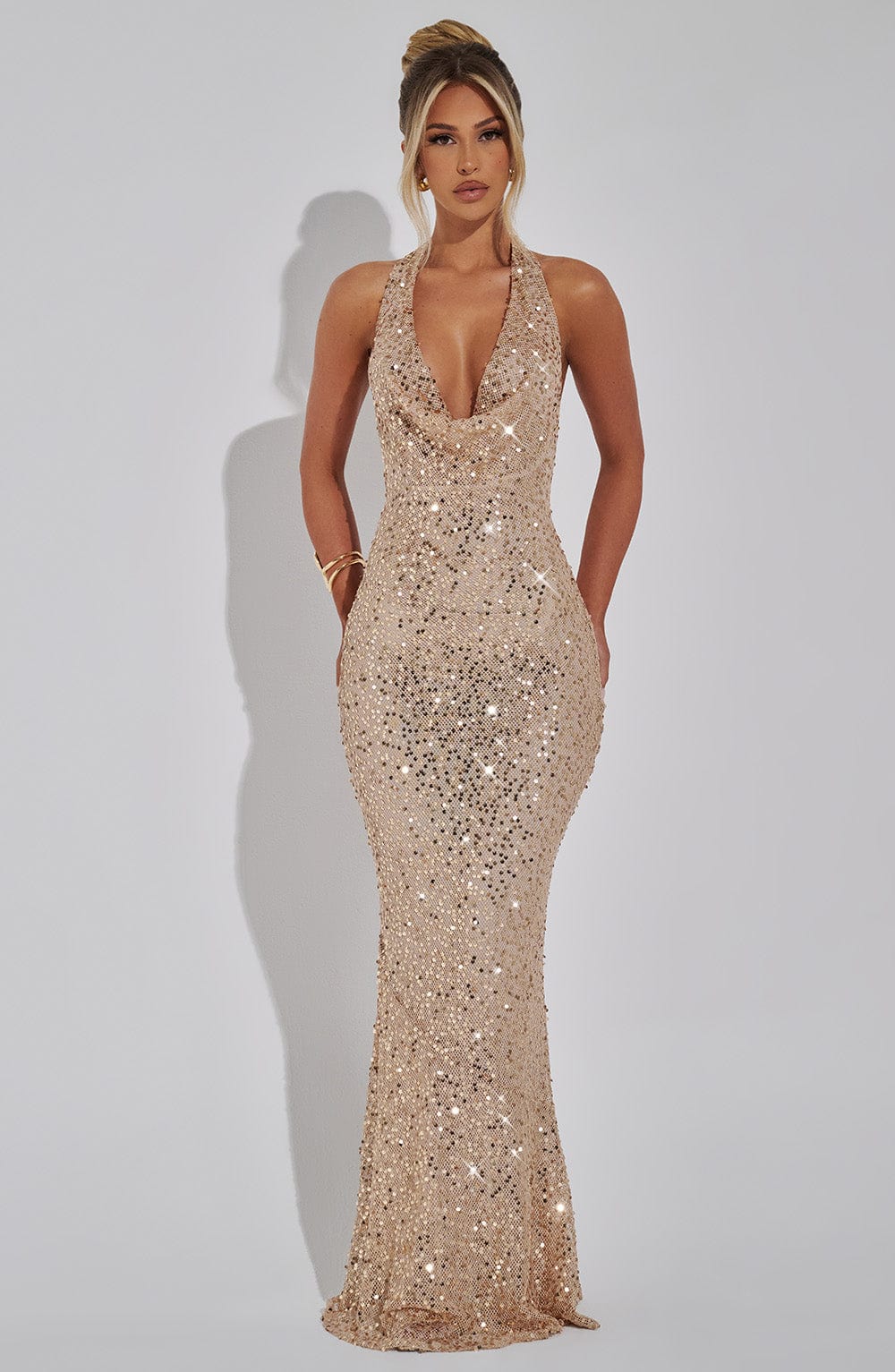 Montaracrest Celeste sequin gown with a flowing design and shimmering silver sequins, elegant evening wear for special occasions.