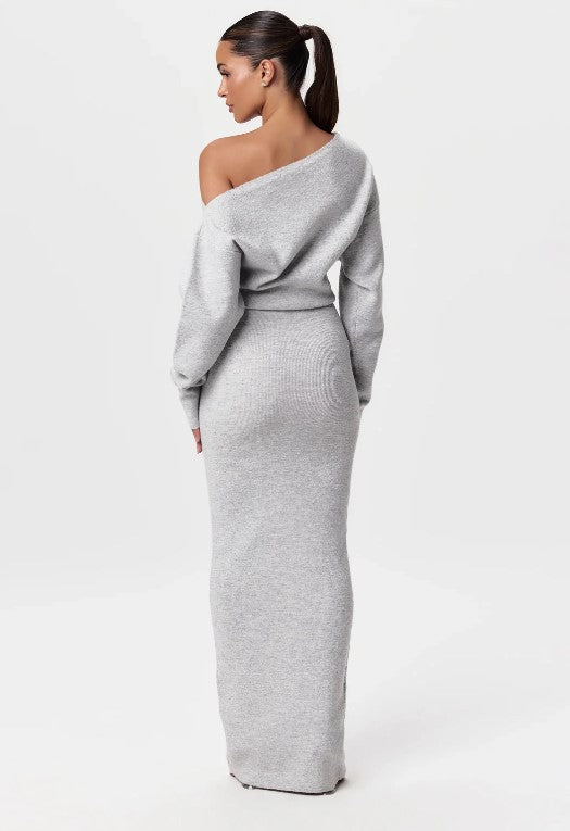 Montaracrest Evelyne off-shoulder dress in soft fabric with ruffle neckline and floral pattern, displayed on a hanger.