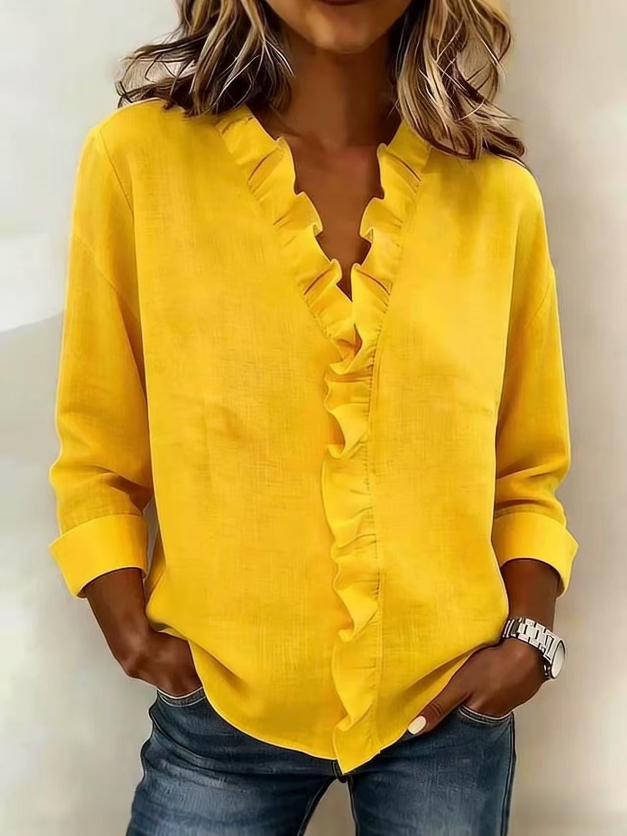 Montaracrest Chiara V-neck blouse with delicate ruffle accents, stylish and feminine top featuring a soft fabric and elegant design.