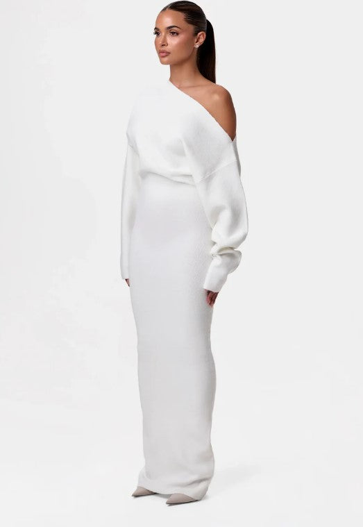Montaracrest Evelyne off-shoulder dress featuring a flowy fabric and elegant design, perfect for summer occasions.