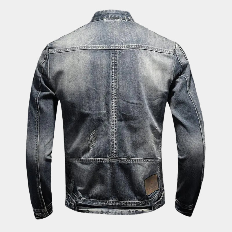 Montara & Crest denim jacket with classic blue wash, featuring a collar, button front, and stylish fit, displayed on a hanger.