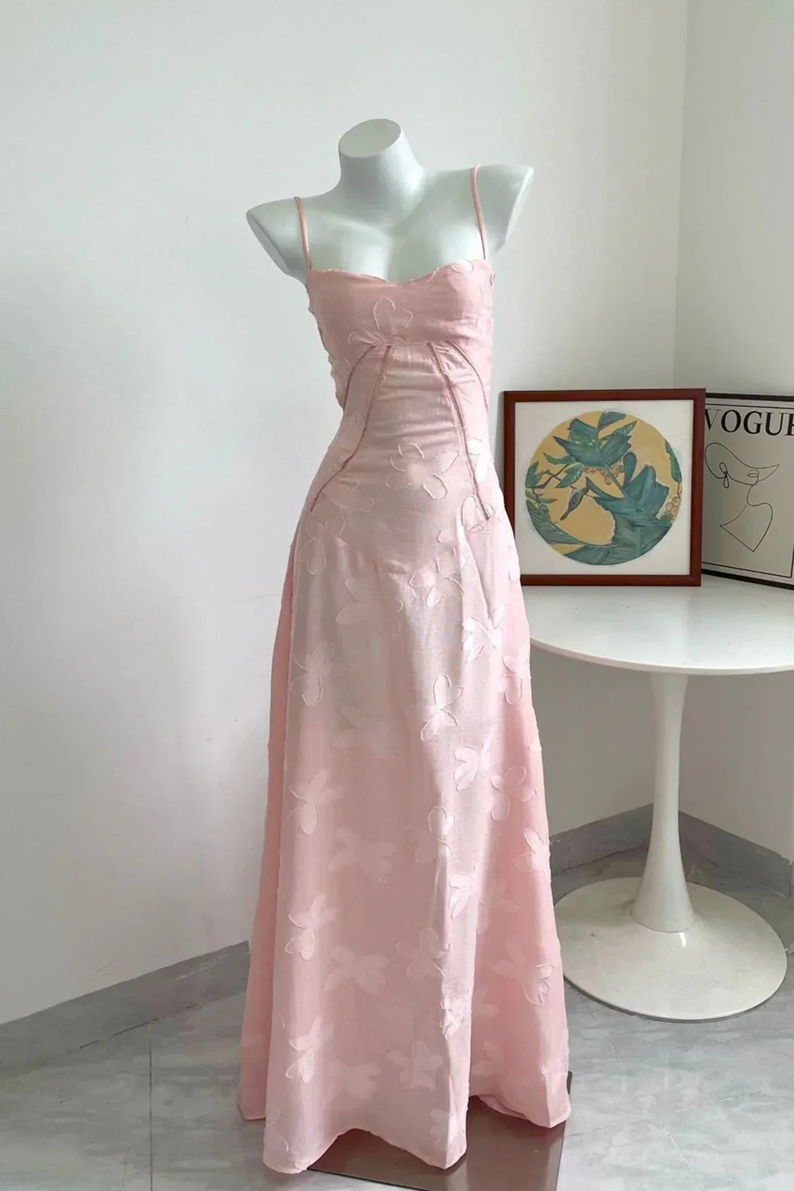 Pink long dress by Montaracrest with elegant, flowing fabric, perfect for special occasions and formal events.