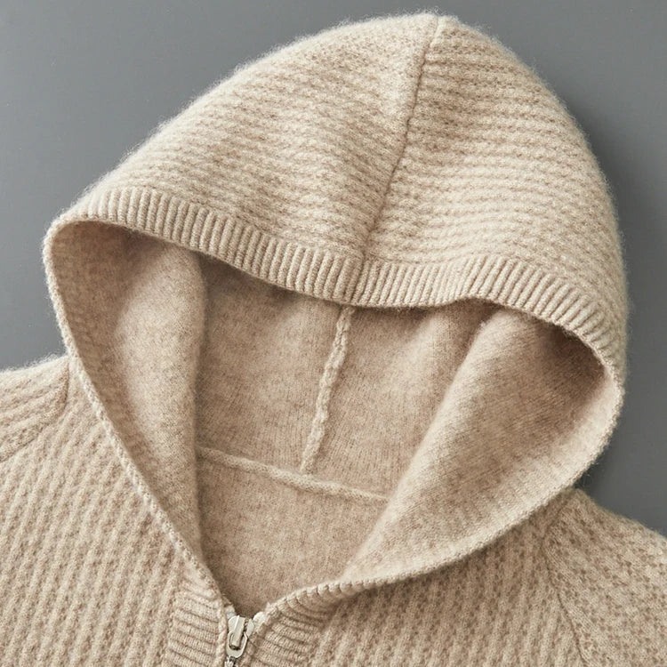 Montaracrest Elio™ cashmere hoodie in luxurious soft cashmere, shown in a cozy, stylish fit with a front pocket and hood.