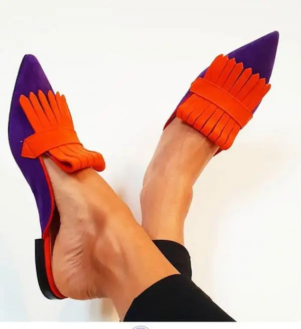 Open-back pointed toe décolleté from Montaracrest featuring a stylish retro heel and elegant design.