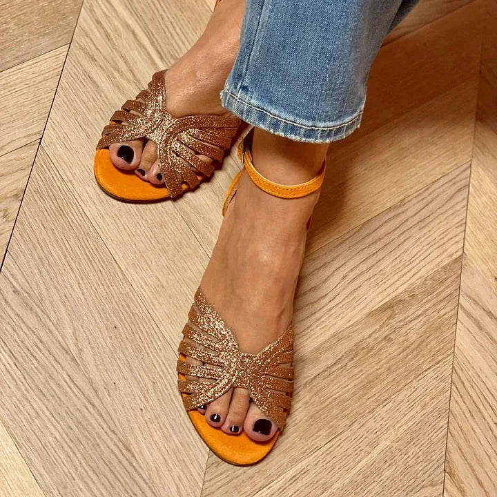 Montaracrest flat sandal with ankle strap, featuring a sleek design and open toe for casual summer wear.