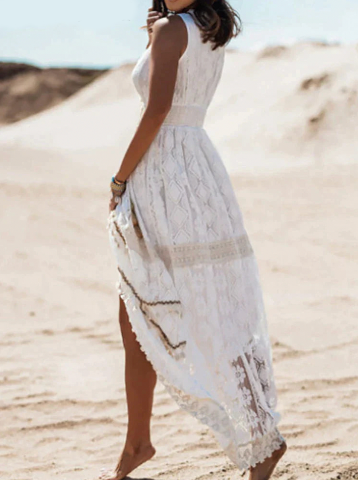 Elegant white midi lace dress with romantic details by Montaracrest, featuring intricate lace patterns and a flowing silhouette.